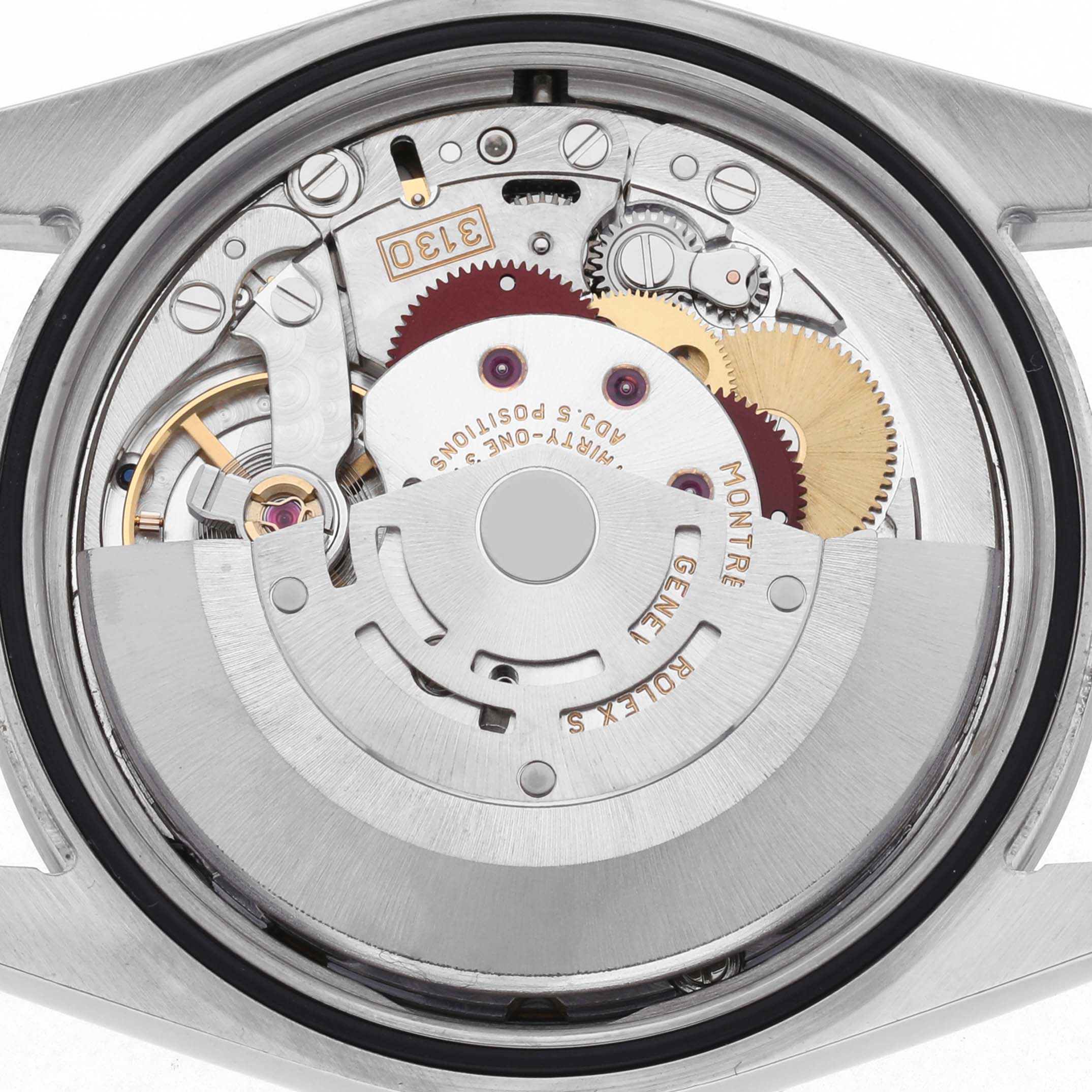 The image shows the movement of a Rolex Explorer 114270 Men's Stainless Steel Black Dial 114270 Men's Stainless Steel Black Dial watch, displaying its internal gears and rotor.