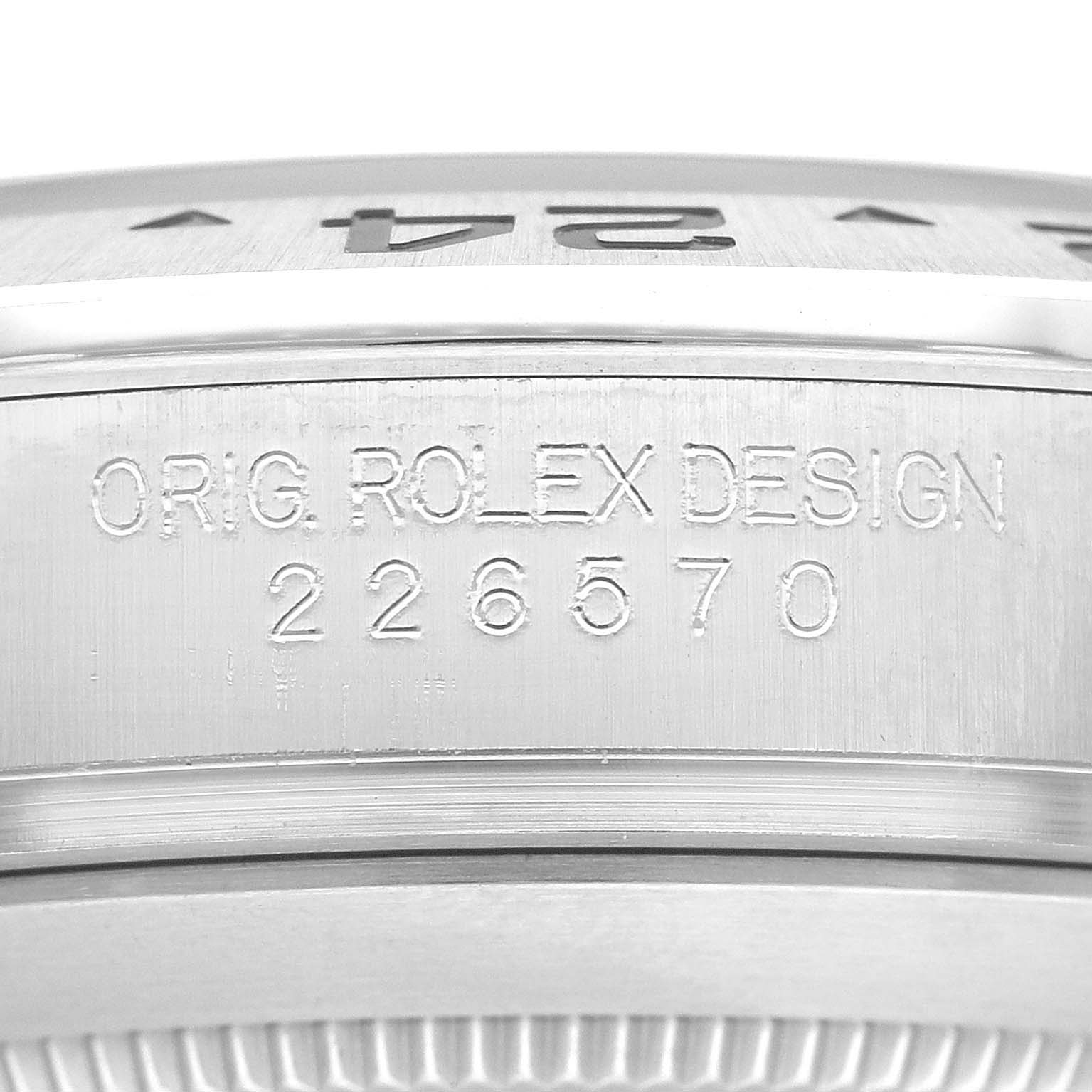 The image shows the side view of the case of a Rolex Explorer 226570 Men's Stainless Steel Black Dial 226570 Men's Stainless Steel Black Dial model, featuring its engraving and part of the bezel.