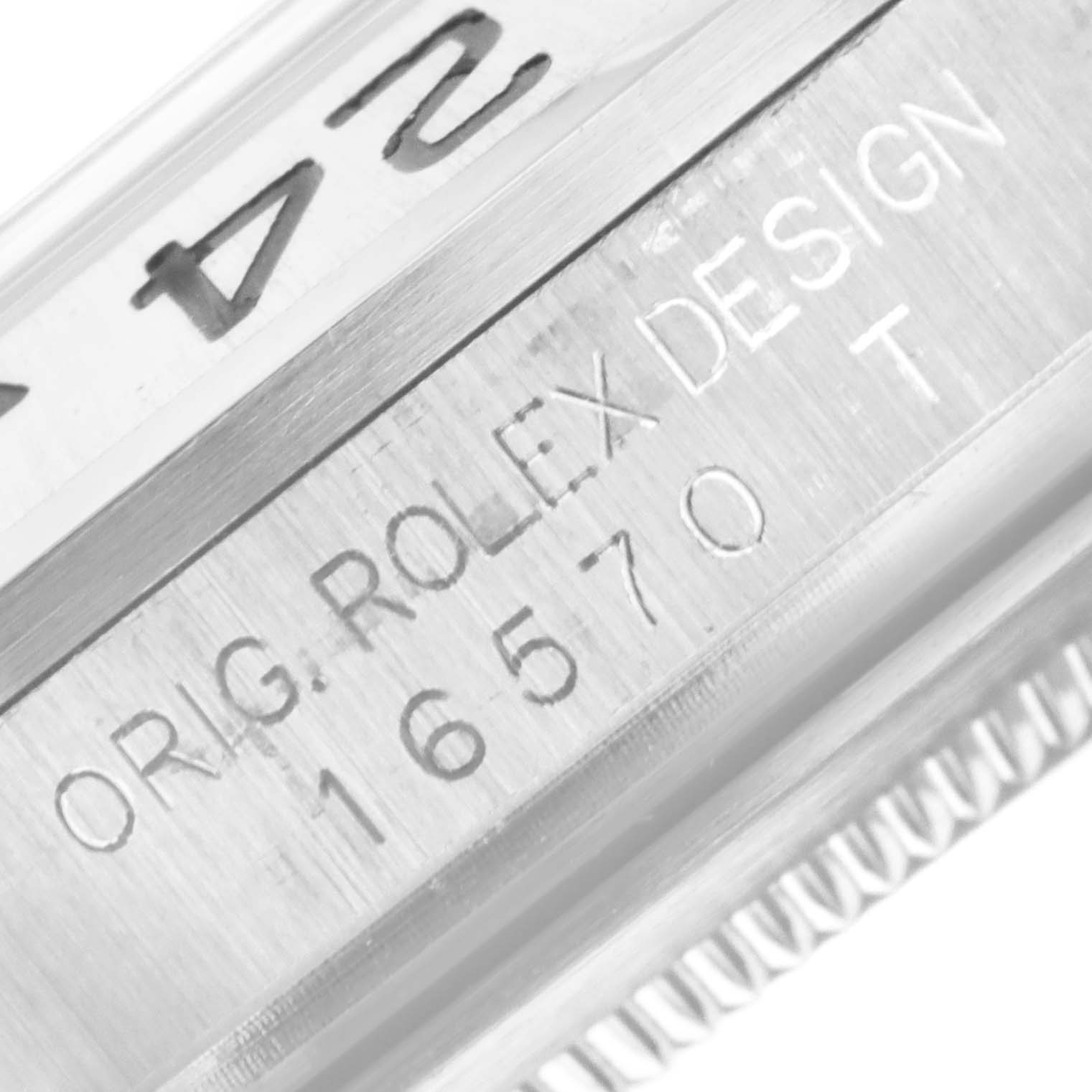 This image shows a close-up of the side engraving on a Rolex Explorer 16570 Men
s Stainless Steel Black Dial 16570 Men
s Stainless Steel Black Dial watch, displaying the model number "16570" and "ORIG. ROLEX DESIGN".