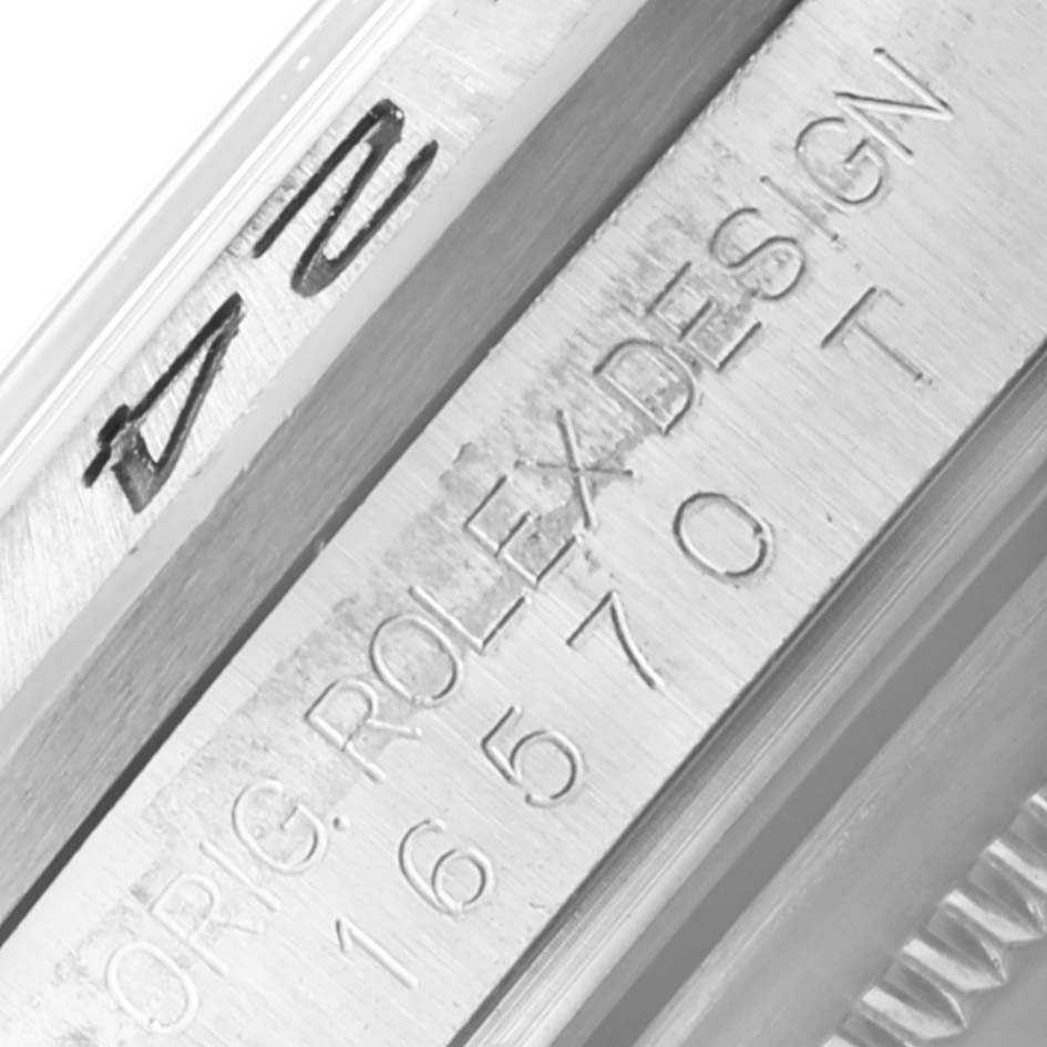 The image shows a close-up of the side engraving on a Rolex Explorer 16570 Men's Stainless Steel Black Dial 16570 Men's Stainless Steel Black Dial watch, including the model and design details.