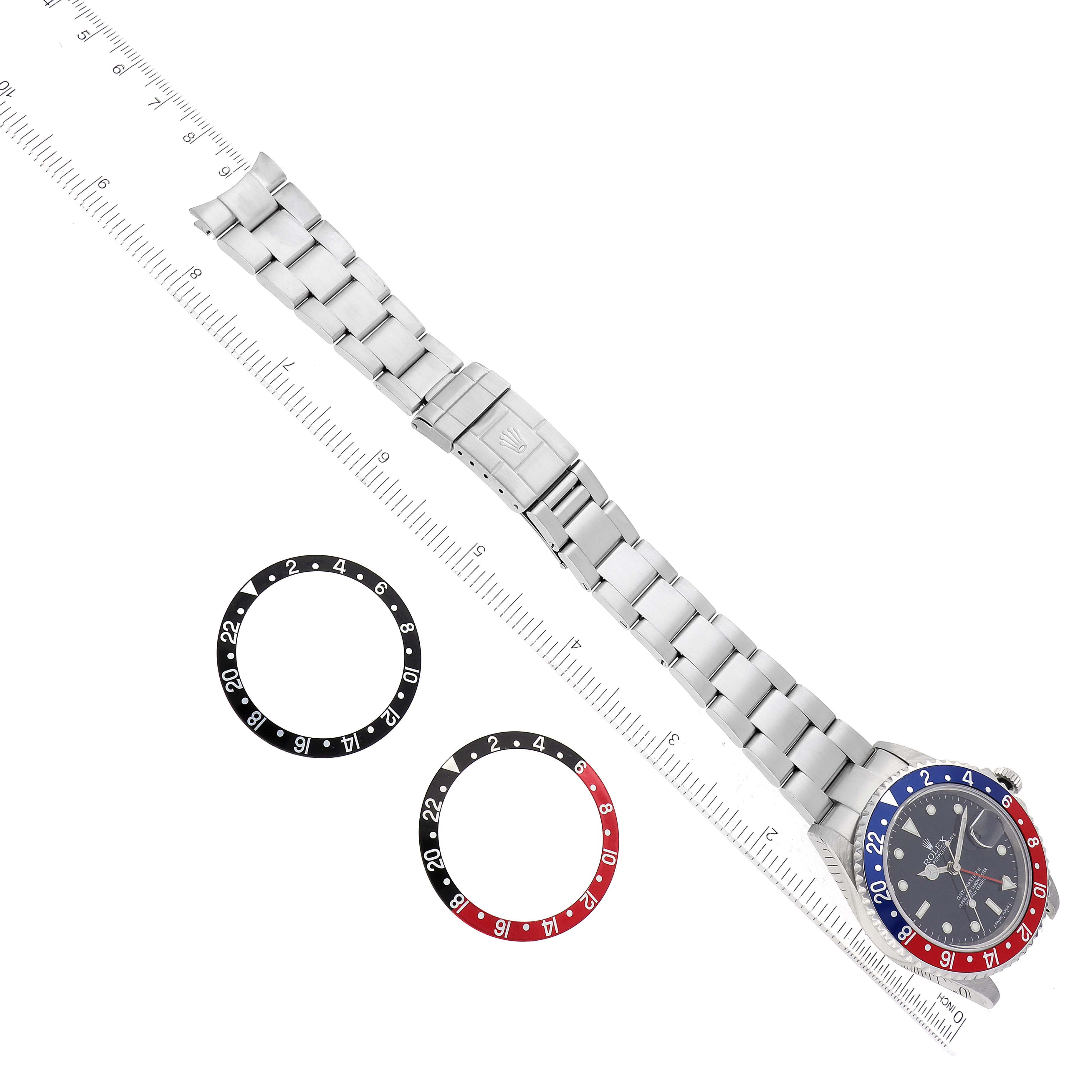 This Rolex GMT-Master 16710 Men's Stainless Steel Black Dial 16710 Men's Stainless Steel Black Dial watch is shown from an overhead angle, displaying the watch bezel, bracelet, and two bezel inserts.