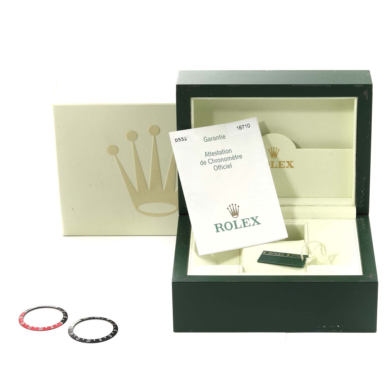 The image shows a Rolex GMT-Master 16710 Men's Stainless Steel Black Dial 16710 Men's Stainless Steel Black Dial box with documents and extra bezel inserts.