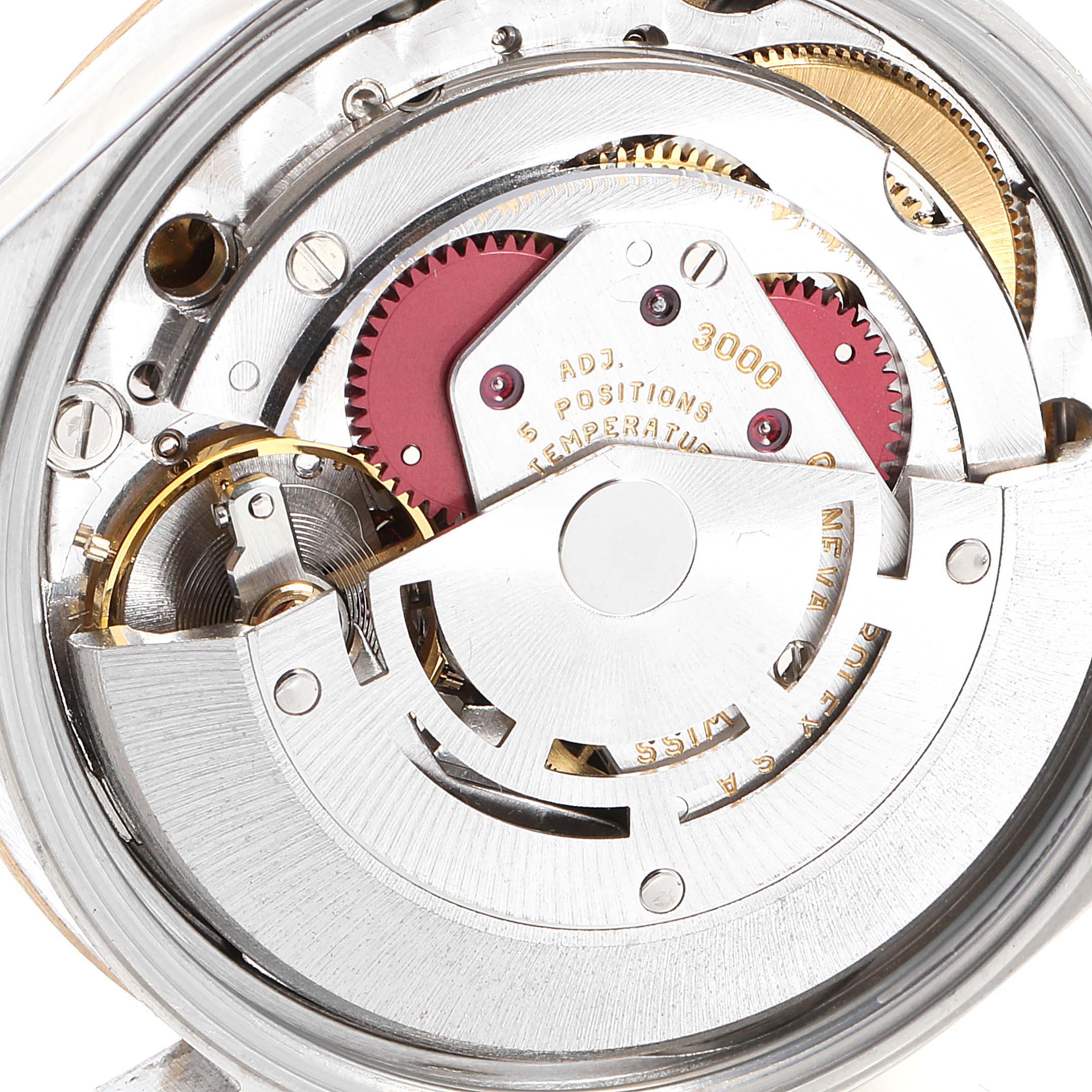 This image shows the internal mechanism of a Rolex Oyster Perpetual 14203 Men's Steel and Gold (two tone) White Dial 14203 Men's Steel and Gold (two tone) White Dial watch, highlighting gears and components.