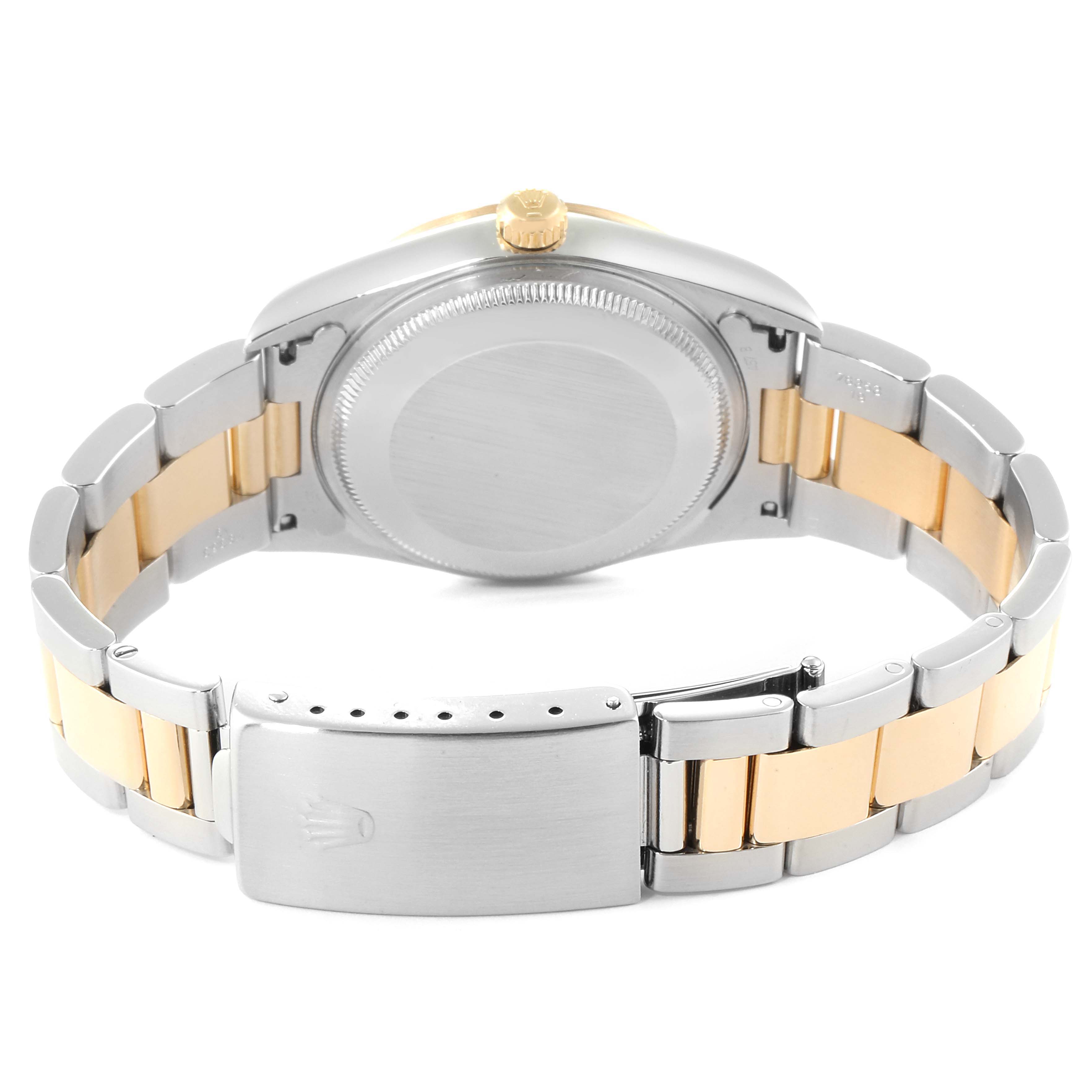 The image shows the back case and bracelet of a Rolex Oyster Perpetual 14203 Men's Steel and Gold (two tone) White Dial 14203 Men's Steel and Gold (two tone) White Dial watch, highlighting its two-tone design and clasp.
