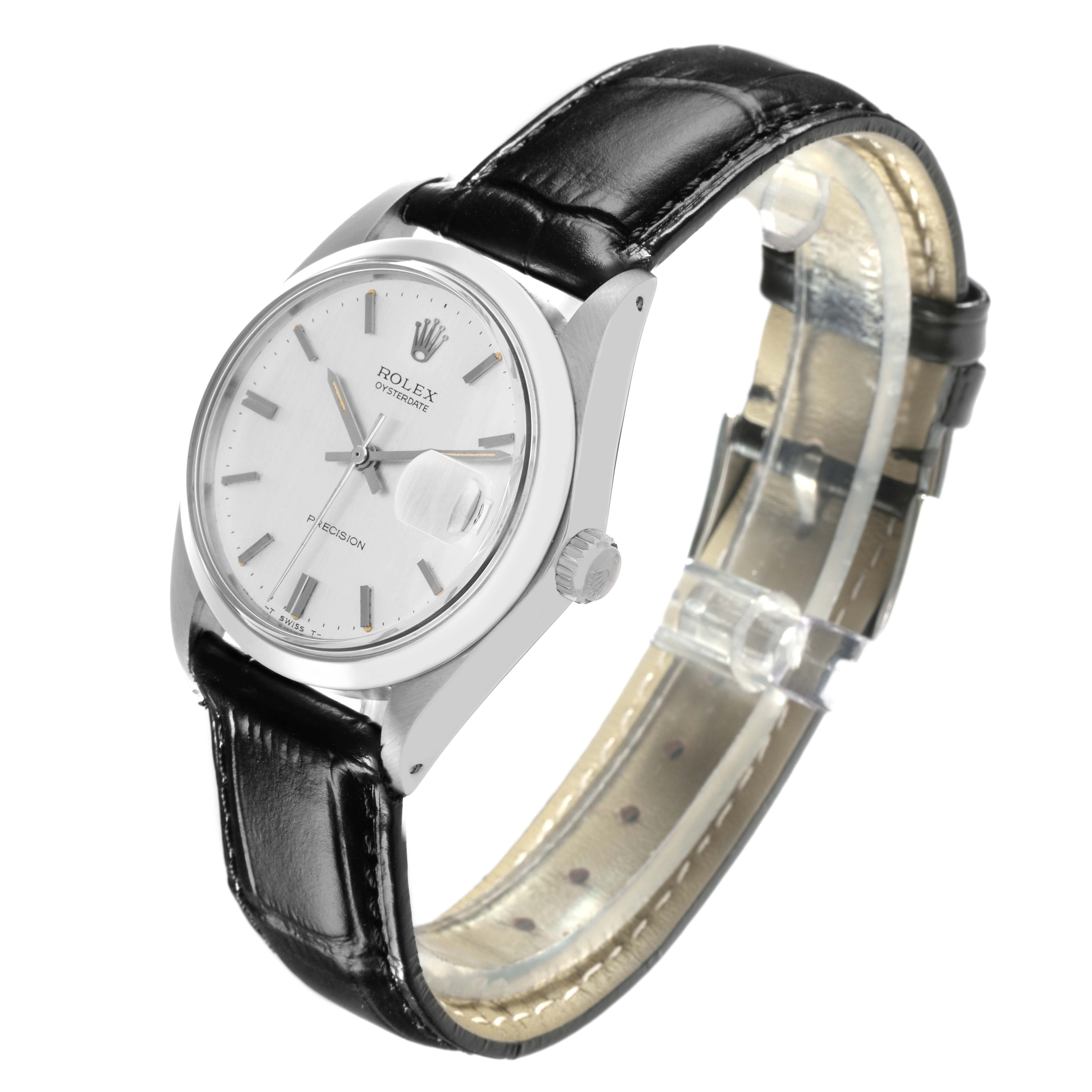 The Rolex Date model watch is shown at a slight angle, highlighting the case, dial, crown, and black leather strap.