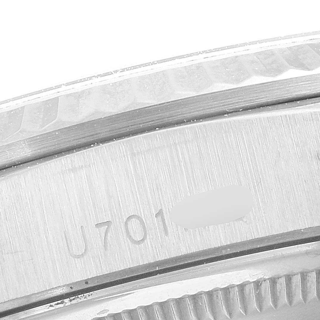 Close-up of the serial number and fluted bezel on a Rolex President 18239 Men
s White Gold Silver Dial 18239 Men
s White Gold Silver Dial model watch.