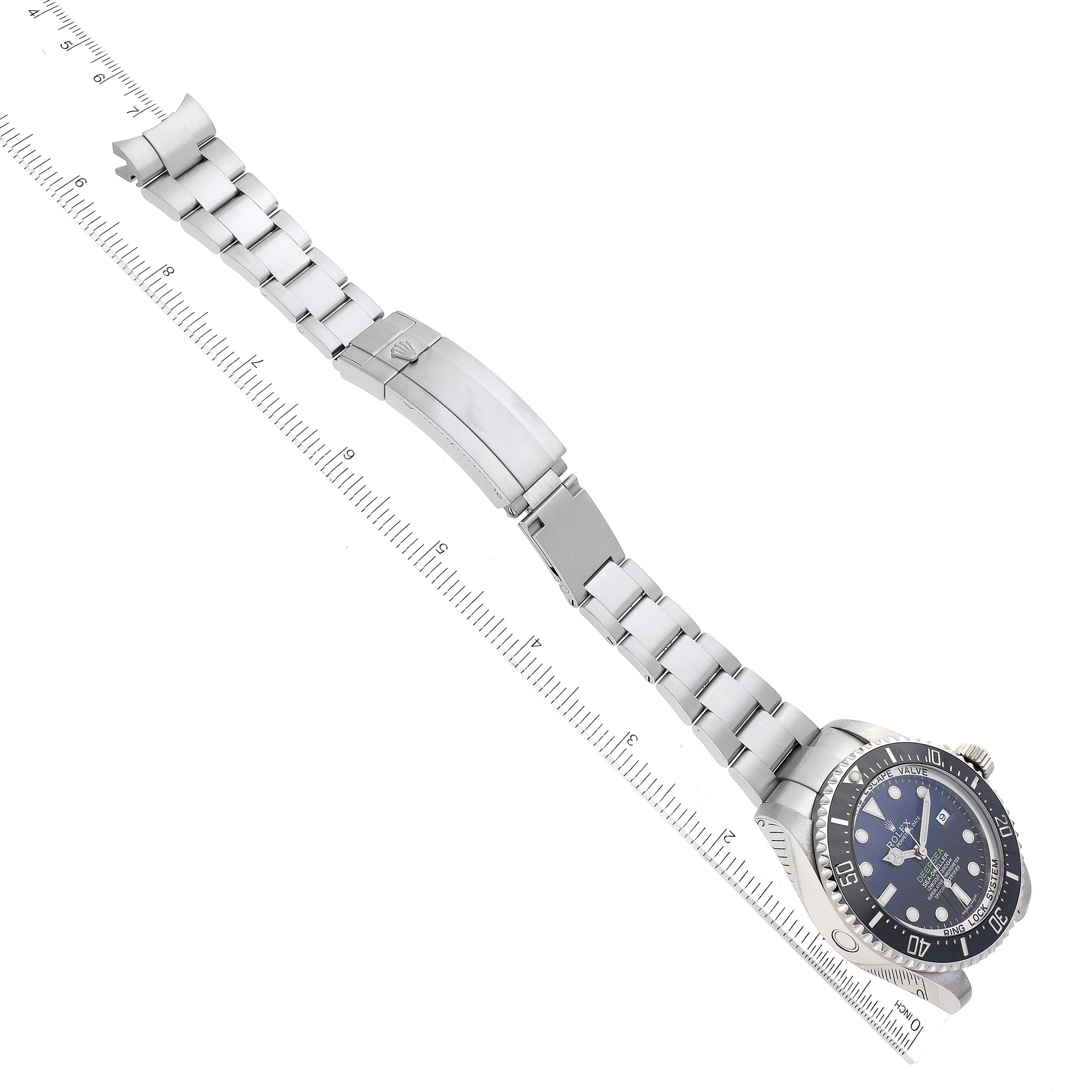 The image shows a top view of a Rolex Sea-Dweller 116660 Men
s Stainless Steel Blue Dial 116660 Men
s Stainless Steel Blue Dial watch, including the dial, bezel, and fully extended metal bracelet.