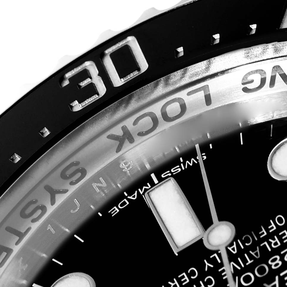 The image shows a close-up angle of the Rolex Sea-Dweller 116660 Men's Stainless Steel Blue Dial 116660 Men's Stainless Steel Blue Dial model's bezel, dial, and part of the text.