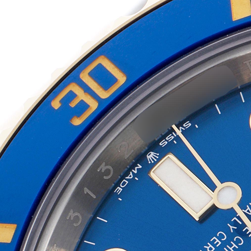 The image shows a close-up of the Rolex Submariner 126613 Men's Steel and Gold (two tone) Blue Dial 126613 Men's Steel and Gold (two tone) Blue Dial watch, focusing on part of the blue bezel and dial.