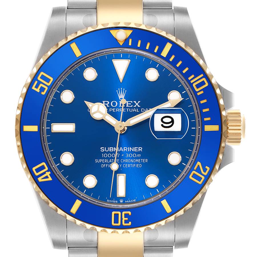 The image shows a front view of a Rolex Submariner watch, highlighting its blue dial, bezel, and gold accents.
