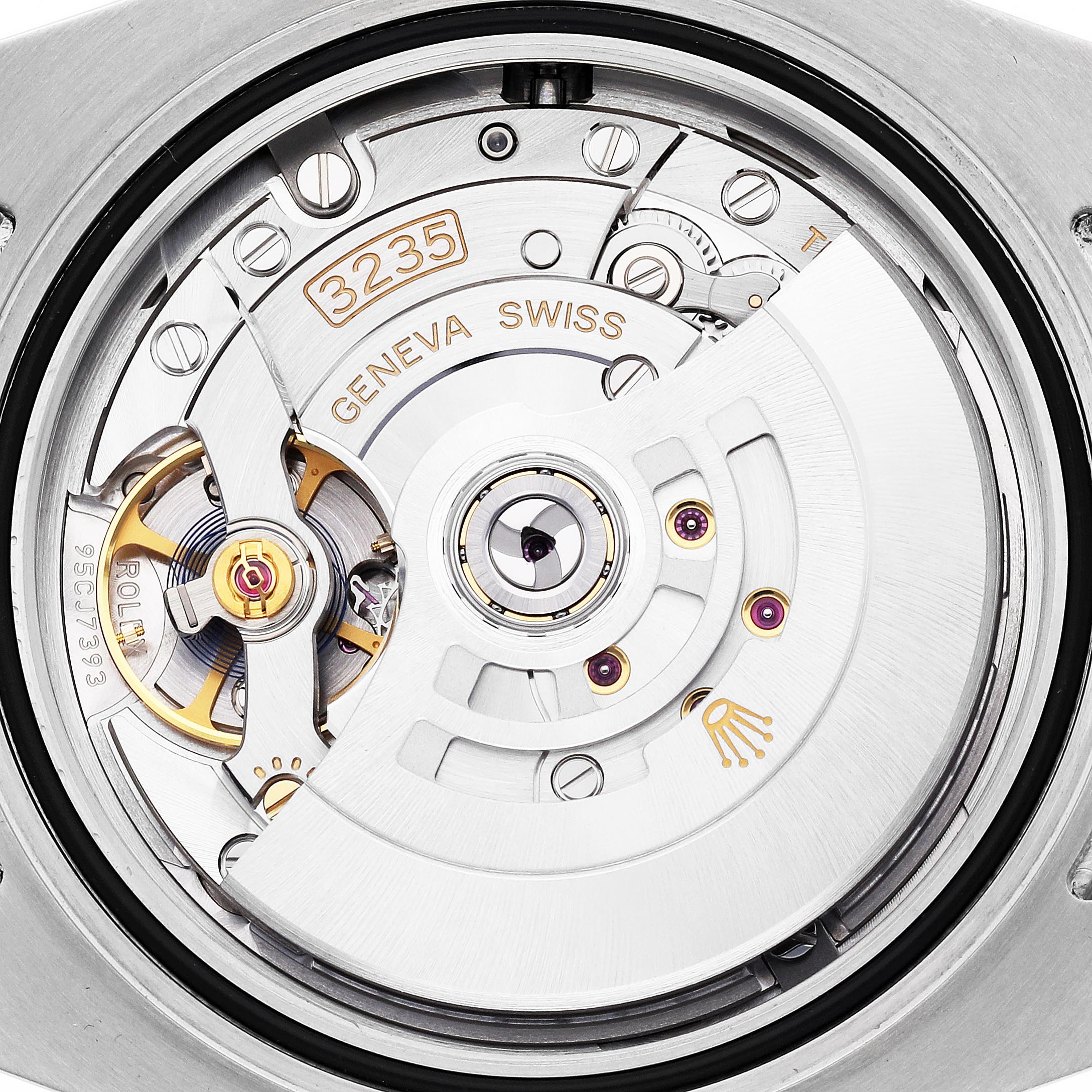 The image shows the movement of a Rolex Submariner 126613 Men's Steel and Gold (two tone) Blue Dial 126613 Men's Steel and Gold (two tone) Blue Dial watch, highlighting the rotor and intricate mechanical parts from a top angle.