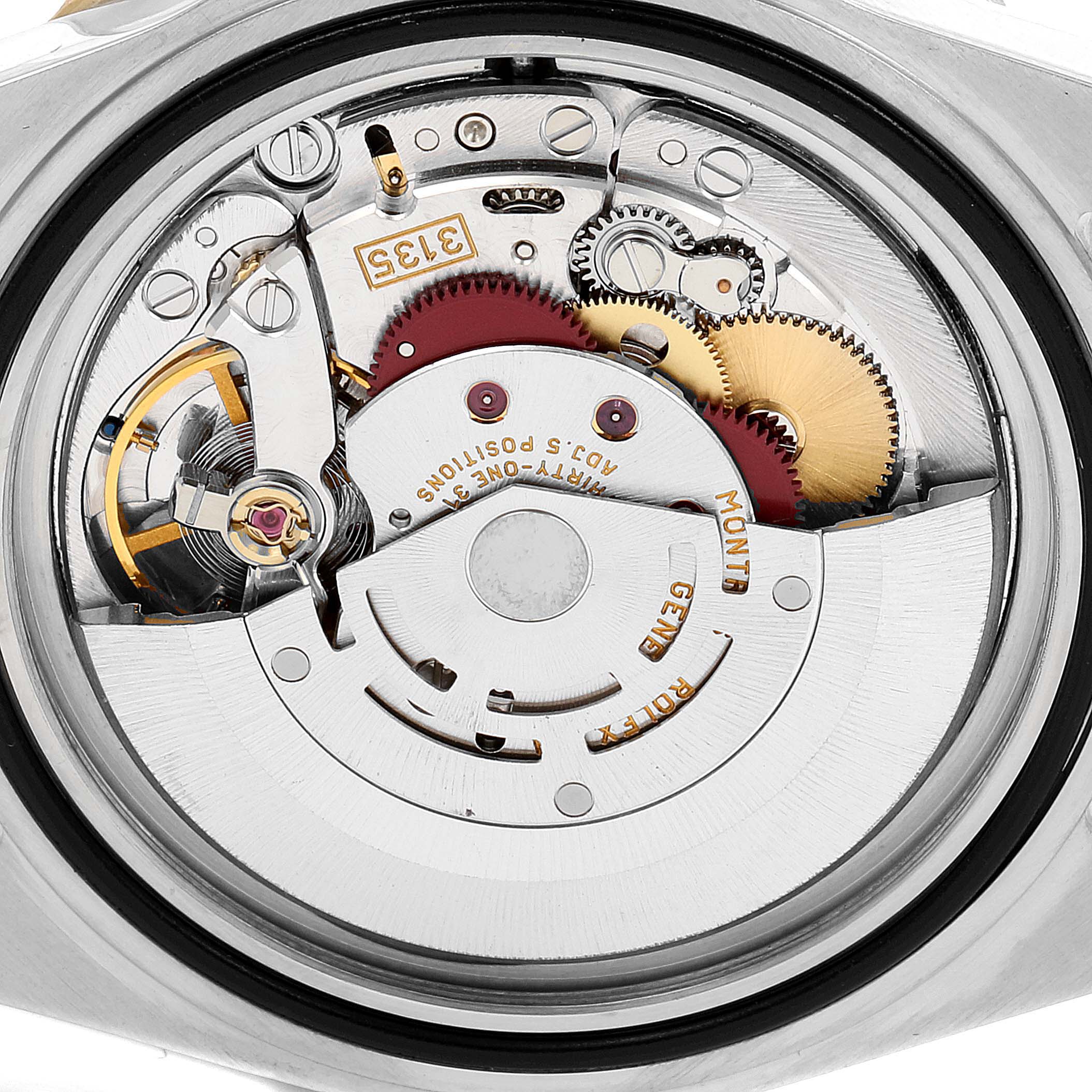 The image shows the internal mechanical movement of a Rolex Submariner 16613 Men
s Steel and Gold (two tone) Blue Dial 16613 Men
s Steel and Gold (two tone) Blue Dial watch viewed from the back.