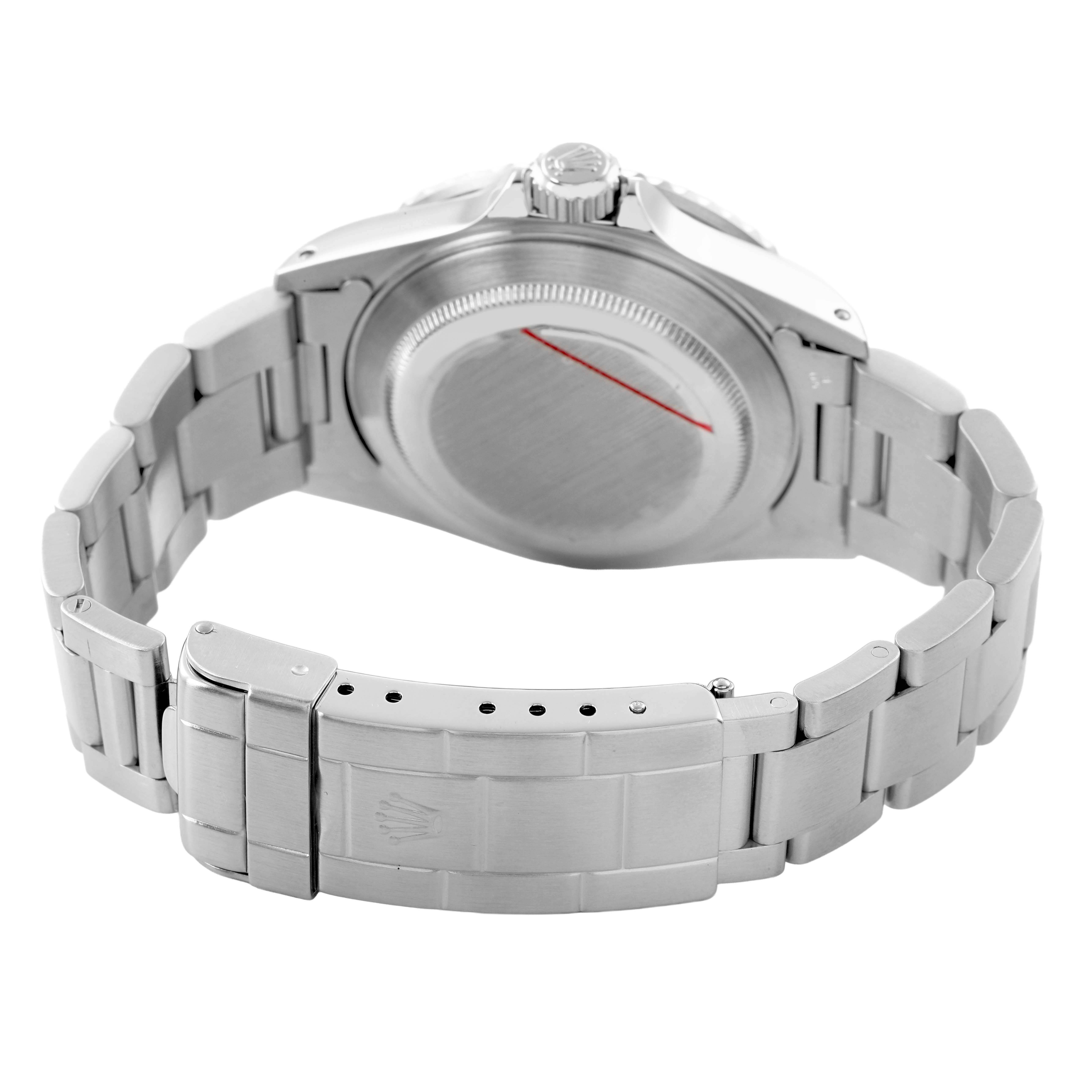 The image shows the back and clasp of a Rolex Submariner 16610 Men's Stainless Steel Black Dial, focusing on the case back and bracelet details.