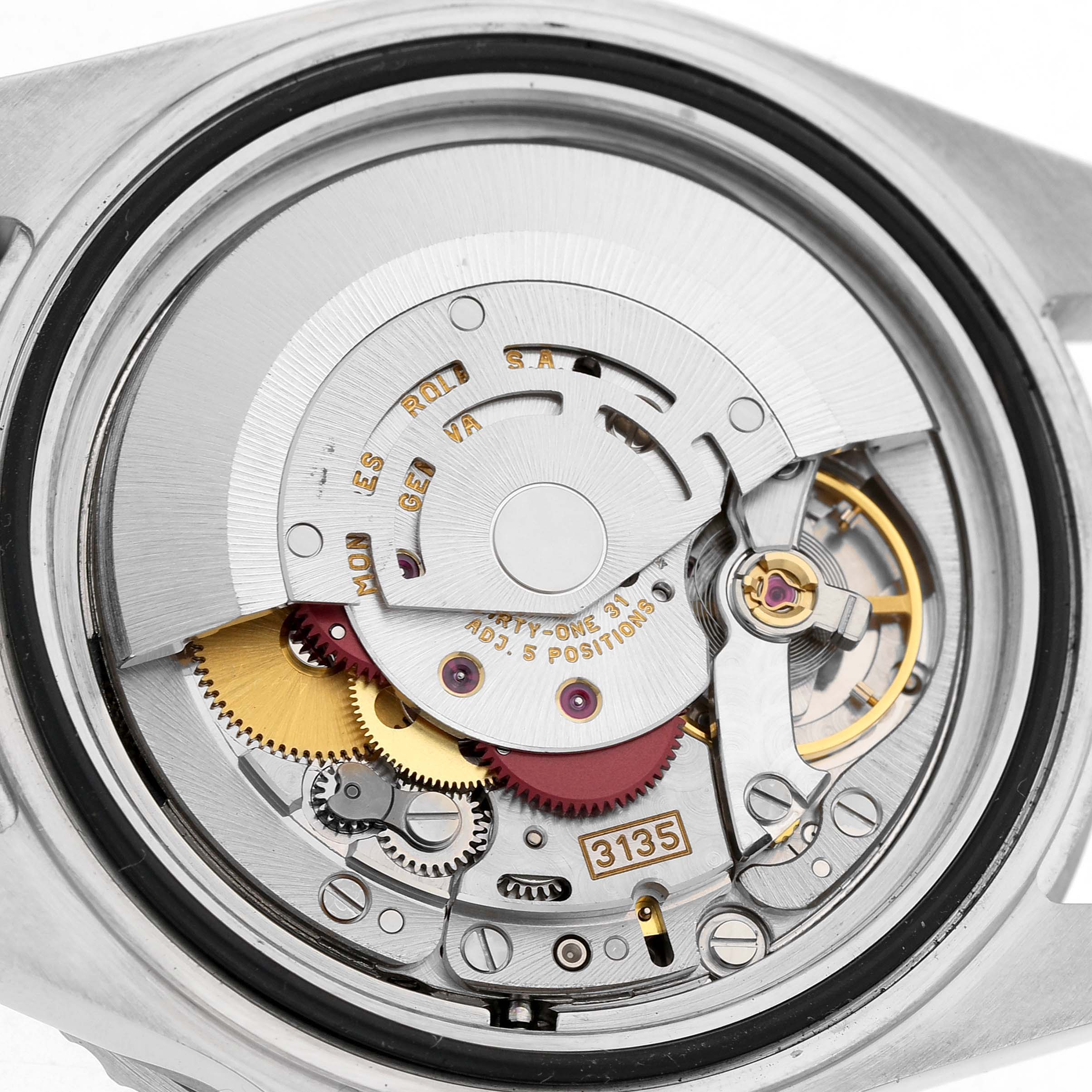 This image shows the movement mechanism of a Rolex Submariner 16610 Men's Stainless Steel Black Dial watch from a back angle, highlighting gears and the rotor.