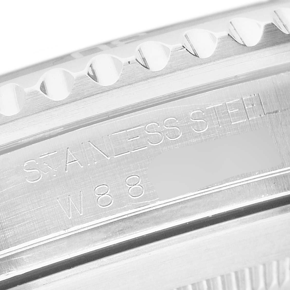 The image shows the side of the Rolex Submariner 16610 Men's Stainless Steel Black Dial, focusing on the stainless steel engraving.
