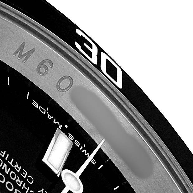The image showcases a close-up of the Rolex Submariner 16610 T Men's Stainless Steel Black Dial's bezel and part of the dial.