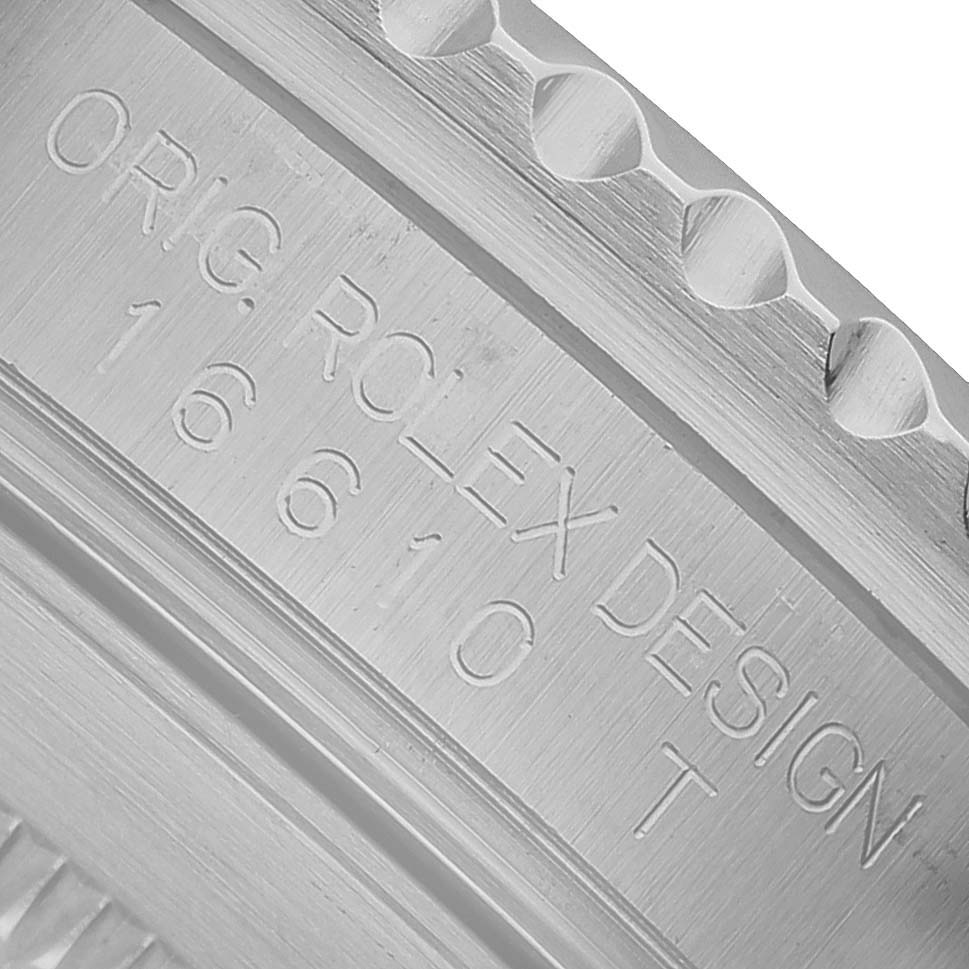 The image shows a close-up of the engraving on the side of the bezel of a Rolex Submariner 16610 T Men's Stainless Steel Black Dial watch.