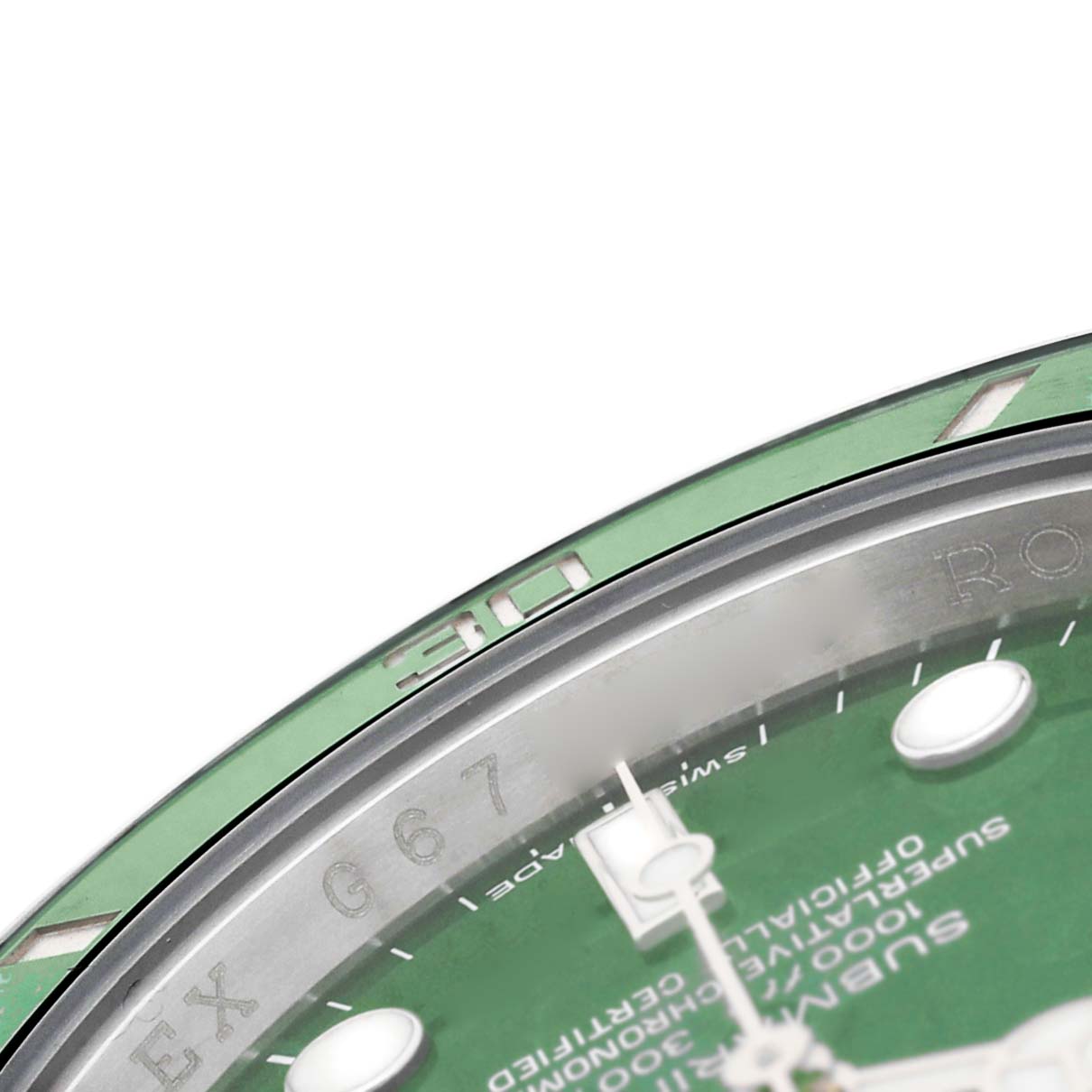 The image shows a close-up of the bezel and part of the dial of a Rolex Submariner 116610LV Men's Stainless Steel Green Dial, viewed from an angled top side.