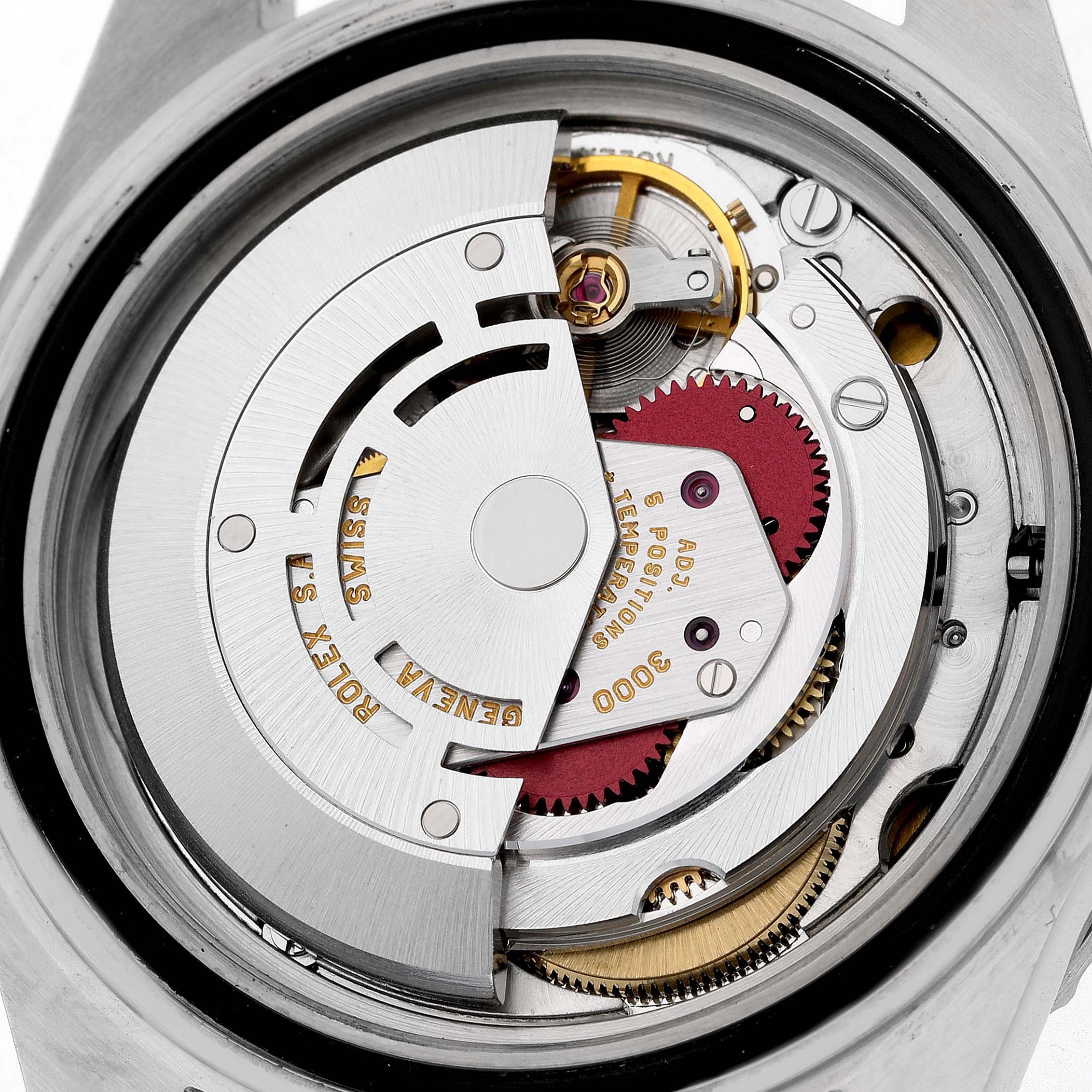 The image shows the inner mechanical movement of a Rolex Submariner 14060 Men's Stainless Steel Black Dial viewed from the back, displaying gears and the rotor.