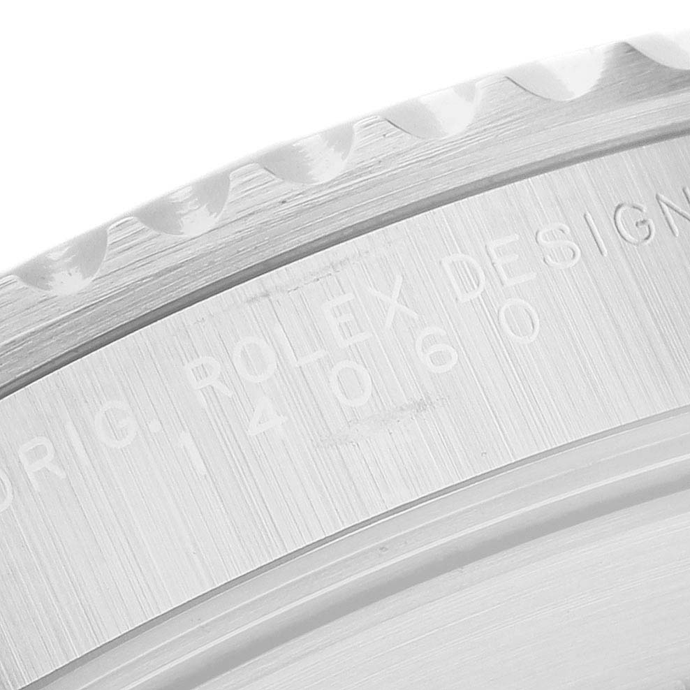 The image shows a close-up of the case back engraving on a Rolex Submariner 14060 Men's Stainless Steel Black Dial, highlighting the model number.