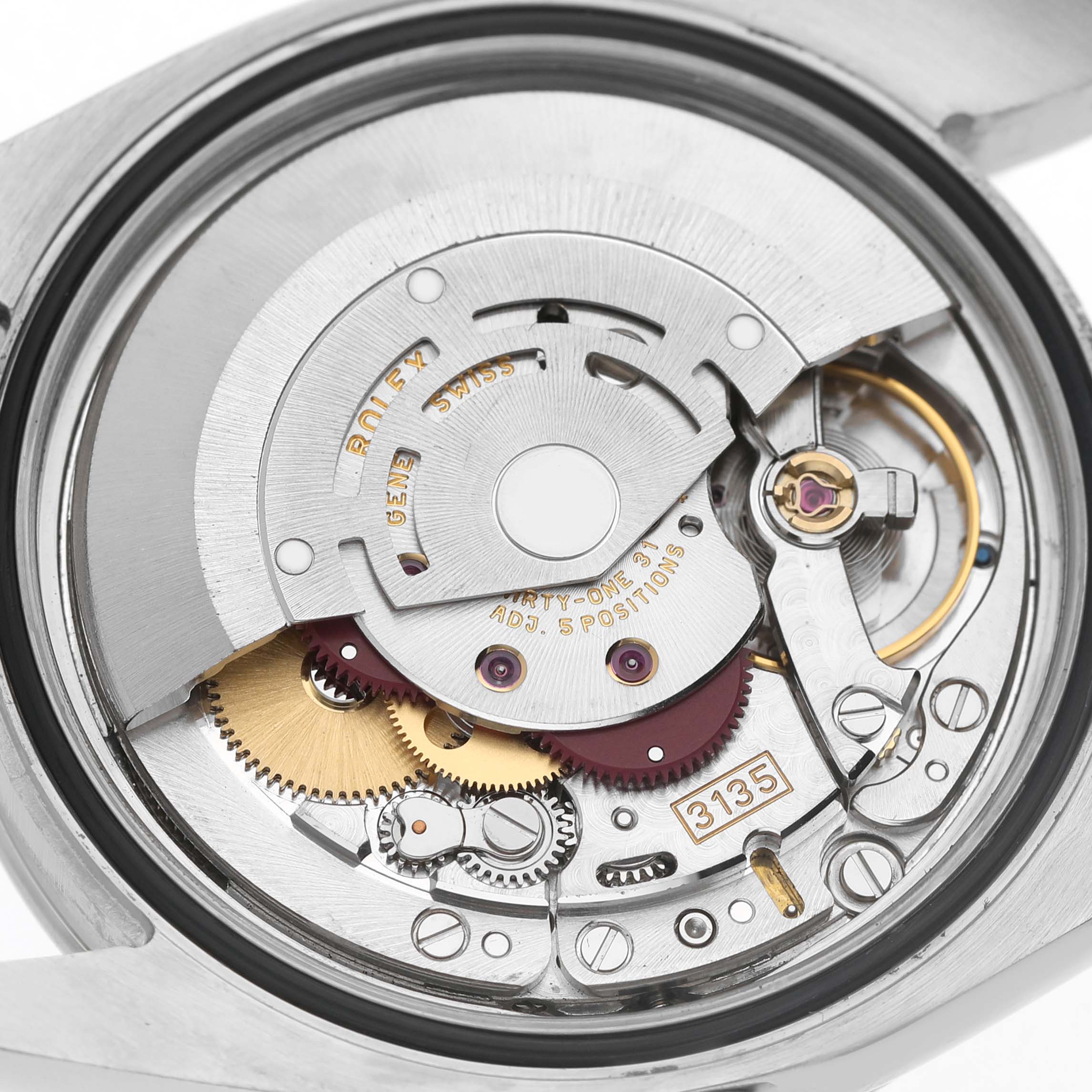 The image shows the internal mechanism of a Rolex Turn-o-Graph 116264 Men's Stainless Steel Black Dial model from the back, highlighting gears and components.