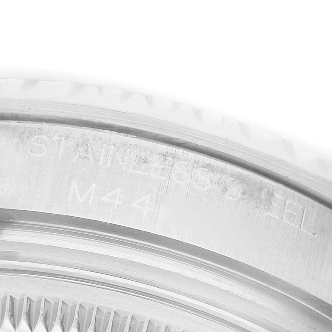 The image shows a close-up view of the engraved stainless steel case back of a Rolex Yacht-Master 168622 Men's Stainless Steel Silver Dial watch.