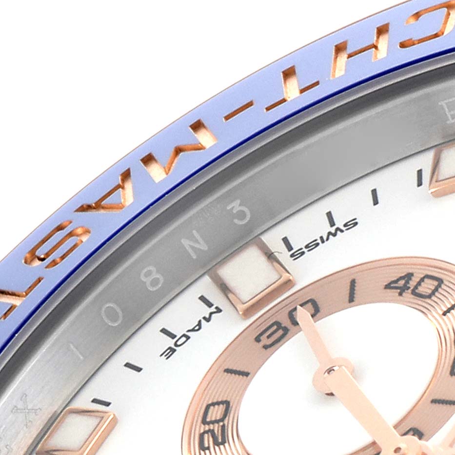 The image shows a close-up of the Rolex Yacht-Master 116681 Men's Steel and Gold (two tone) White Dial 116681 Men's Steel and Gold (two tone) White Dial's bezel with visible hour markers and part of the dial.