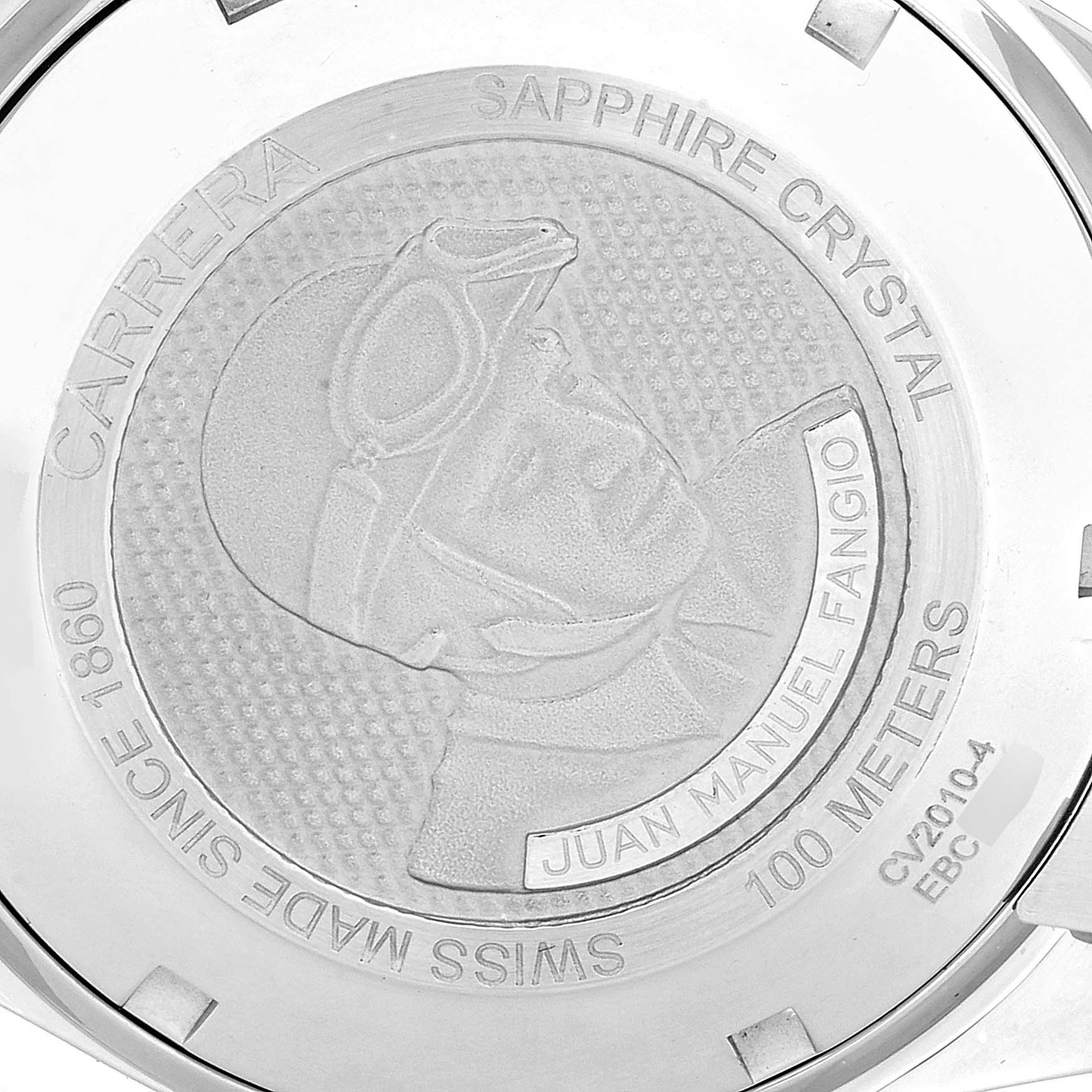 This image shows the engraved back case of the Tag Heuer Carrera CV2010 Men
s Stainless Steel Black Dial CV2010 Men
s Stainless Steel Black Dial watch with a depiction and text about Juan Manuel Fangio.