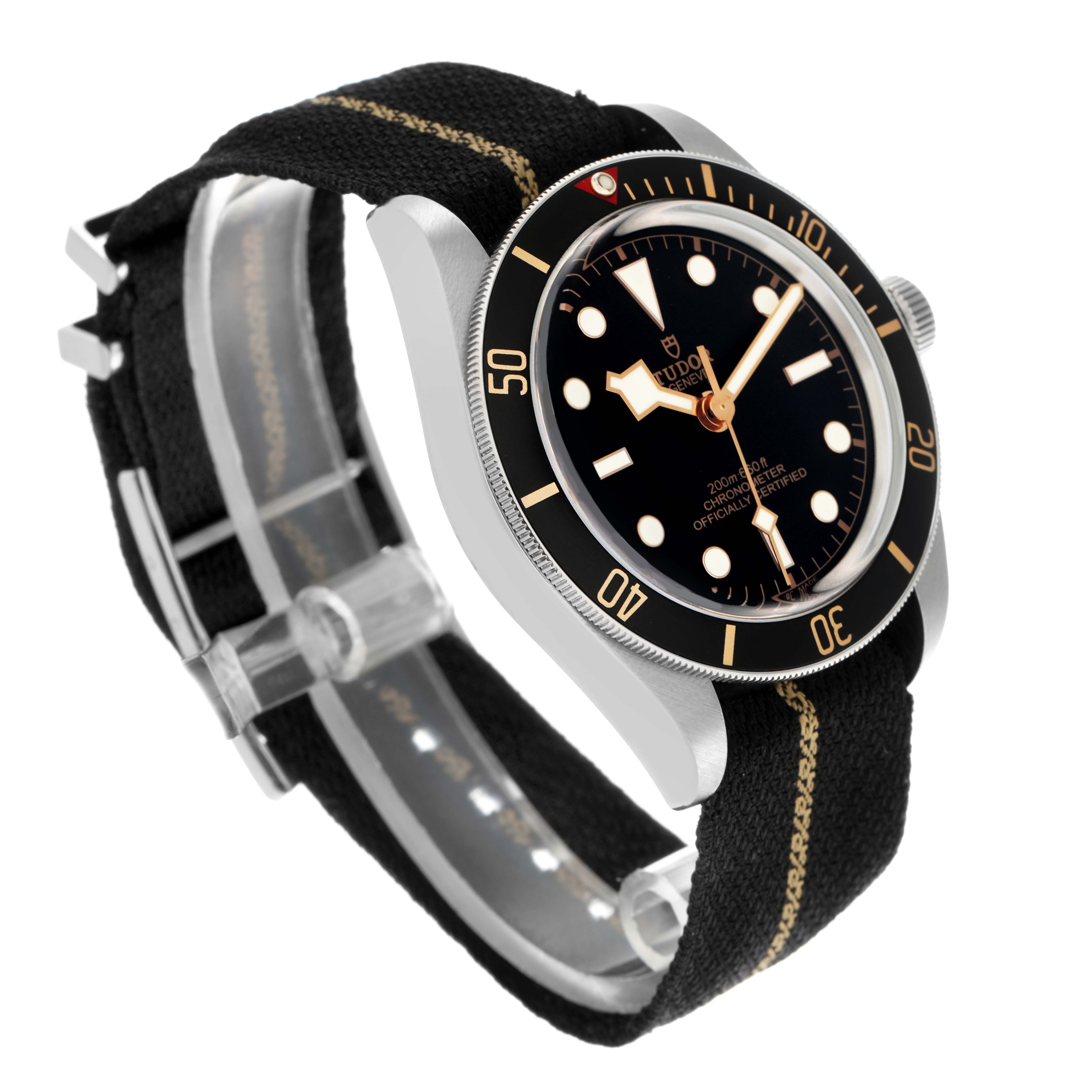 The Tudor Heritage Black Bay 79030 Men
s Stainless Steel Black Dial 79030 Men
s Stainless Steel Black Dial watch is shown from a three-quarter angle, highlighting its black dial, bezel, and fabric strap.