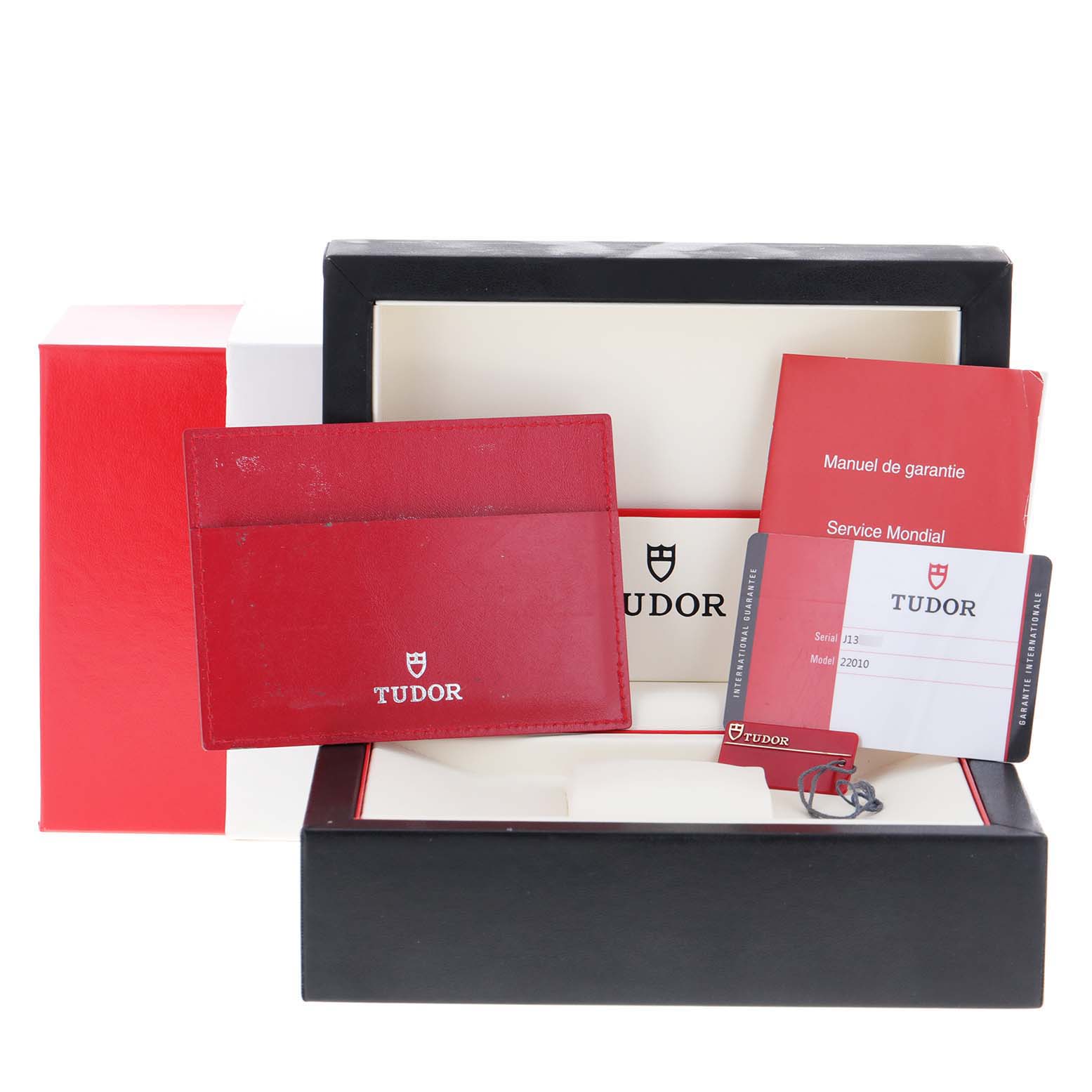 This image shows the packaging, warranty card, and manual for the Tudor Classic 22010 Women
s Stainless Steel White Dial 22010 Women
s Stainless Steel White Dial model watch.