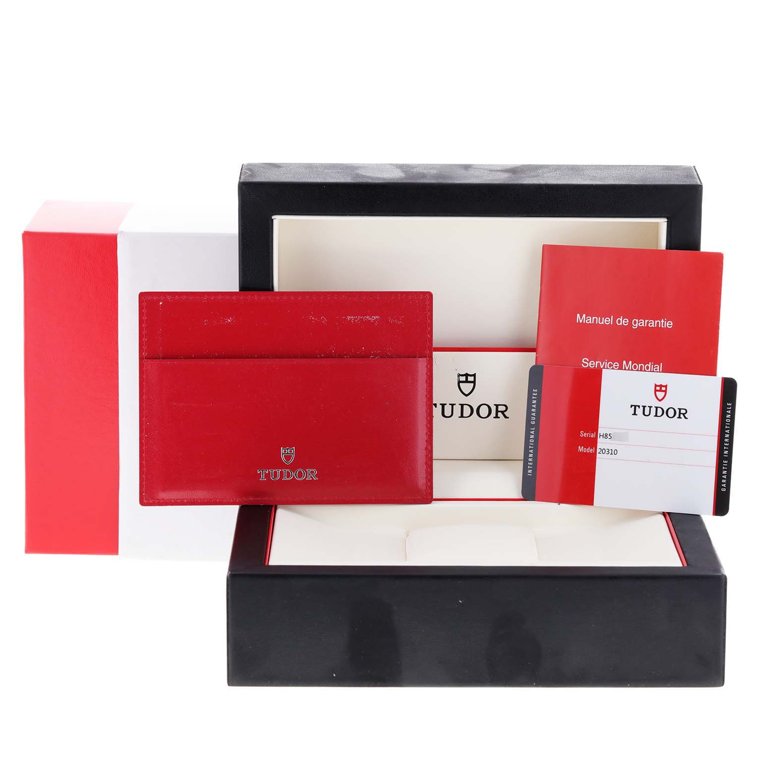 The image shows the Tudor Grantour 20310 Men
s Stainless Steel White Dial 20310 Men
s Stainless Steel White Dial watch box, warranty card, manuals, and a red cardholder.