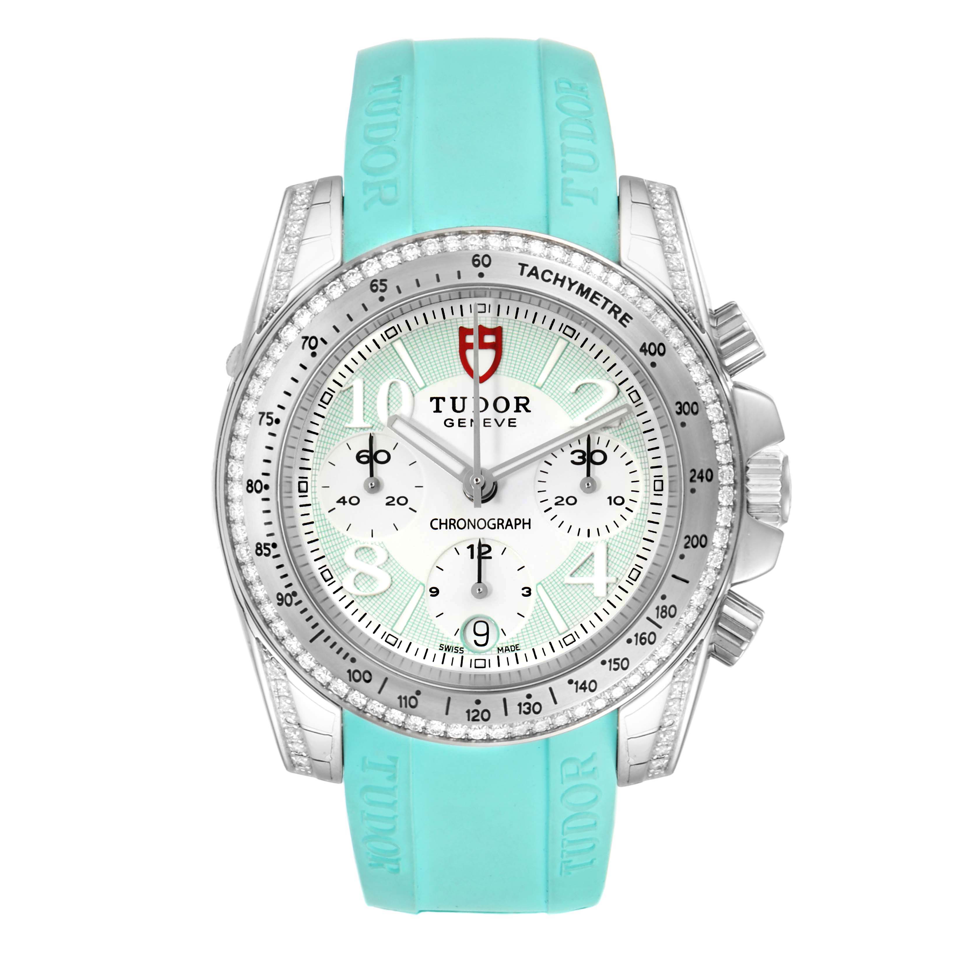 The image shows a front view of a Tudor Grantour 20310 Men
s Stainless Steel White Dial 20310 Men
s Stainless Steel White Dial model watch with a turquoise strap and silver bezel.