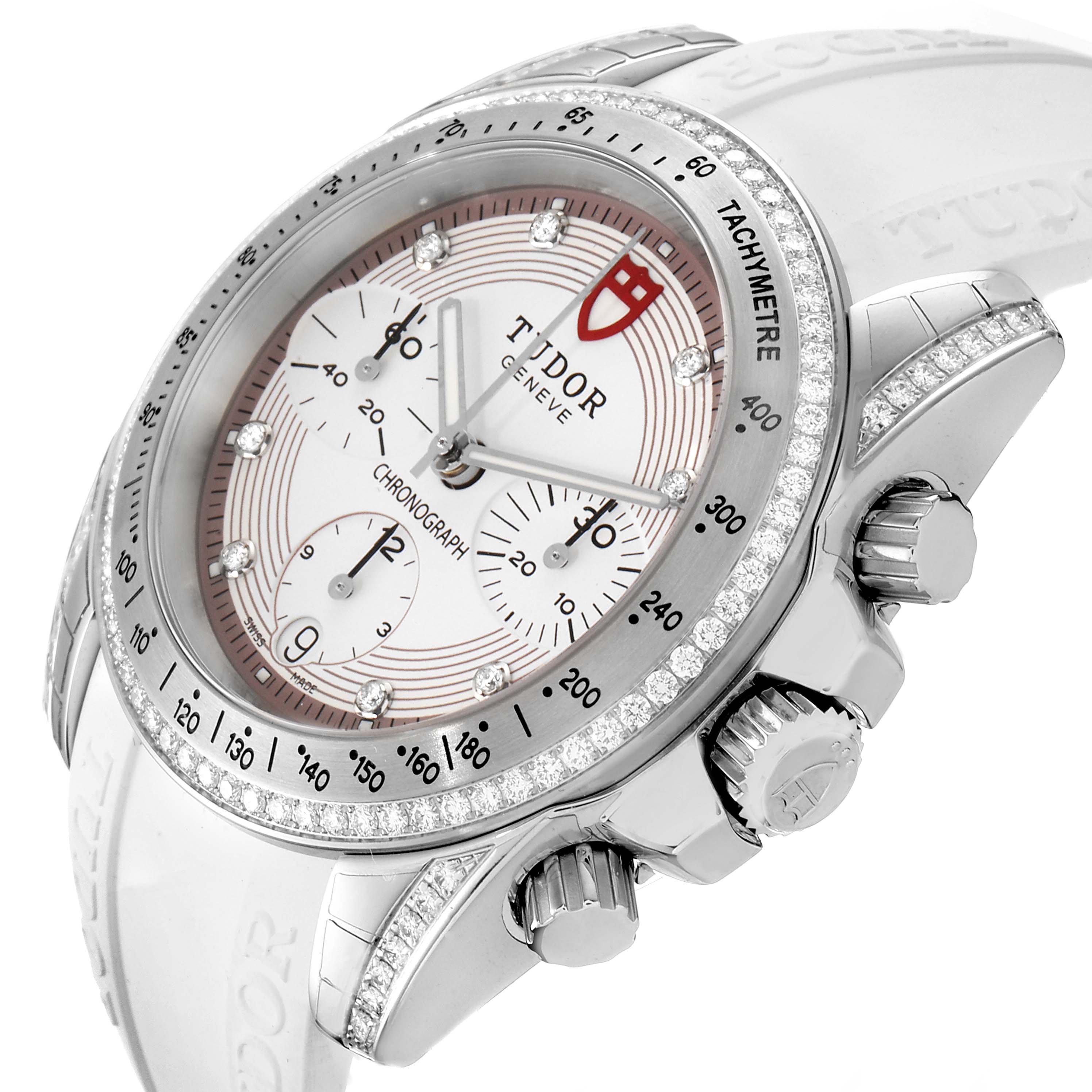 The Tudor Grantour 20310 Men's Stainless Steel White Dial 20310 Men's Stainless Steel White Dial watch is shown at an angle highlighting its face, bezel, and side pushers and crown.