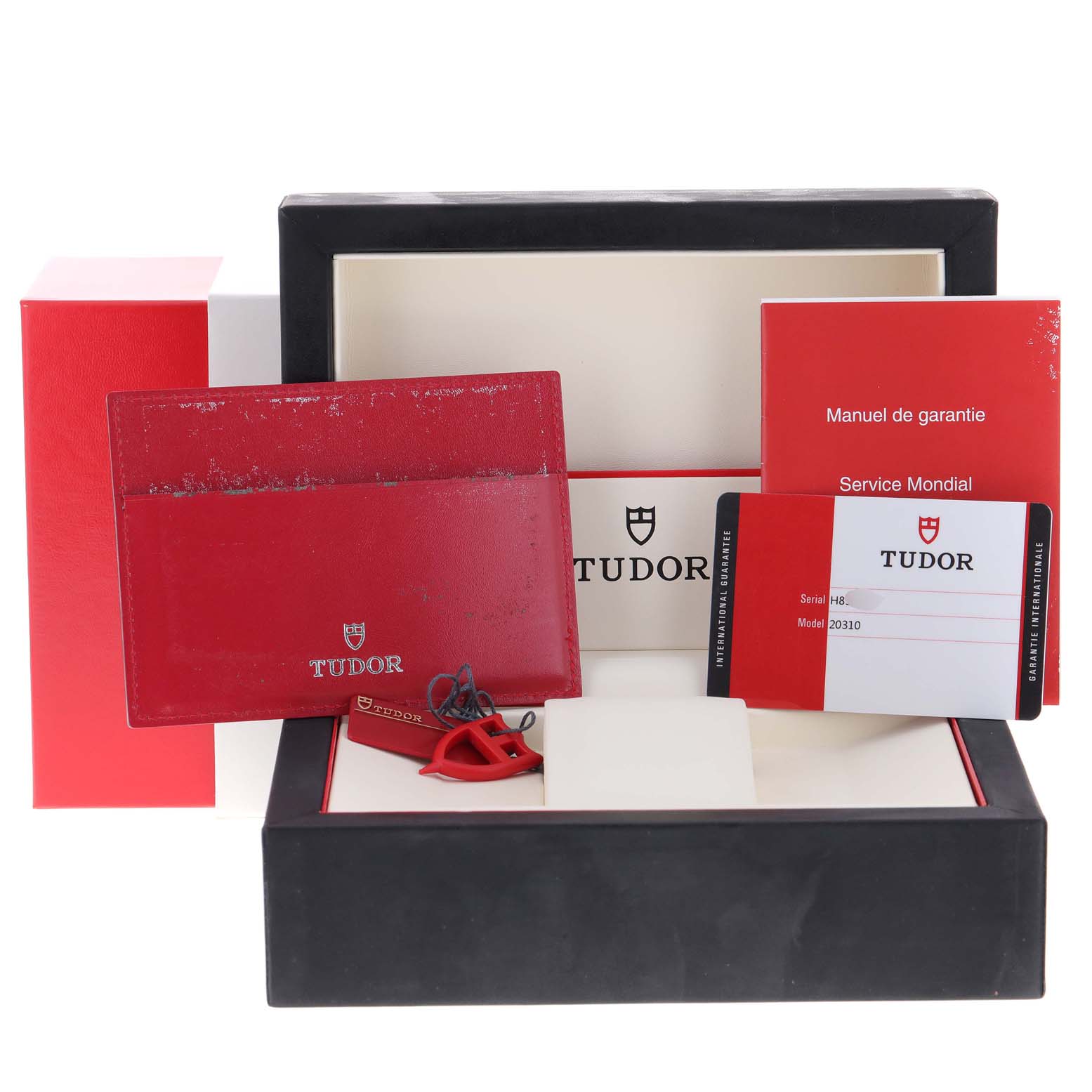 The image shows packaging materials, warranty card, manual, and accessories for a Tudor Grantour 20310 Men's Stainless Steel White Dial 20310 Men's Stainless Steel White Dial watch.