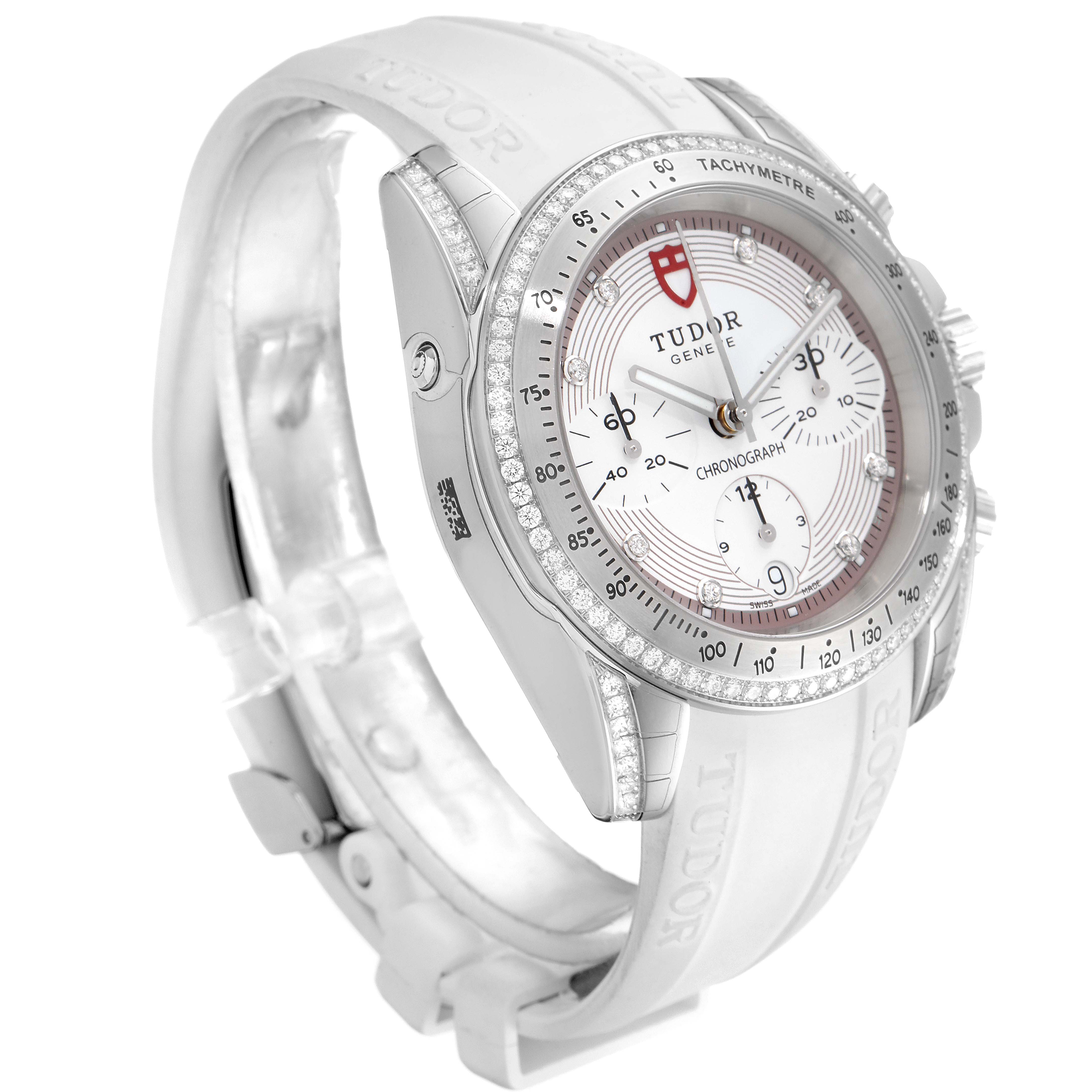 The image shows a side-front view of the Tudor Grantour 20310 Men's Stainless Steel White Dial 20310 Men's Stainless Steel White Dial model watch, highlighting its bezel, dial, and rubber strap.