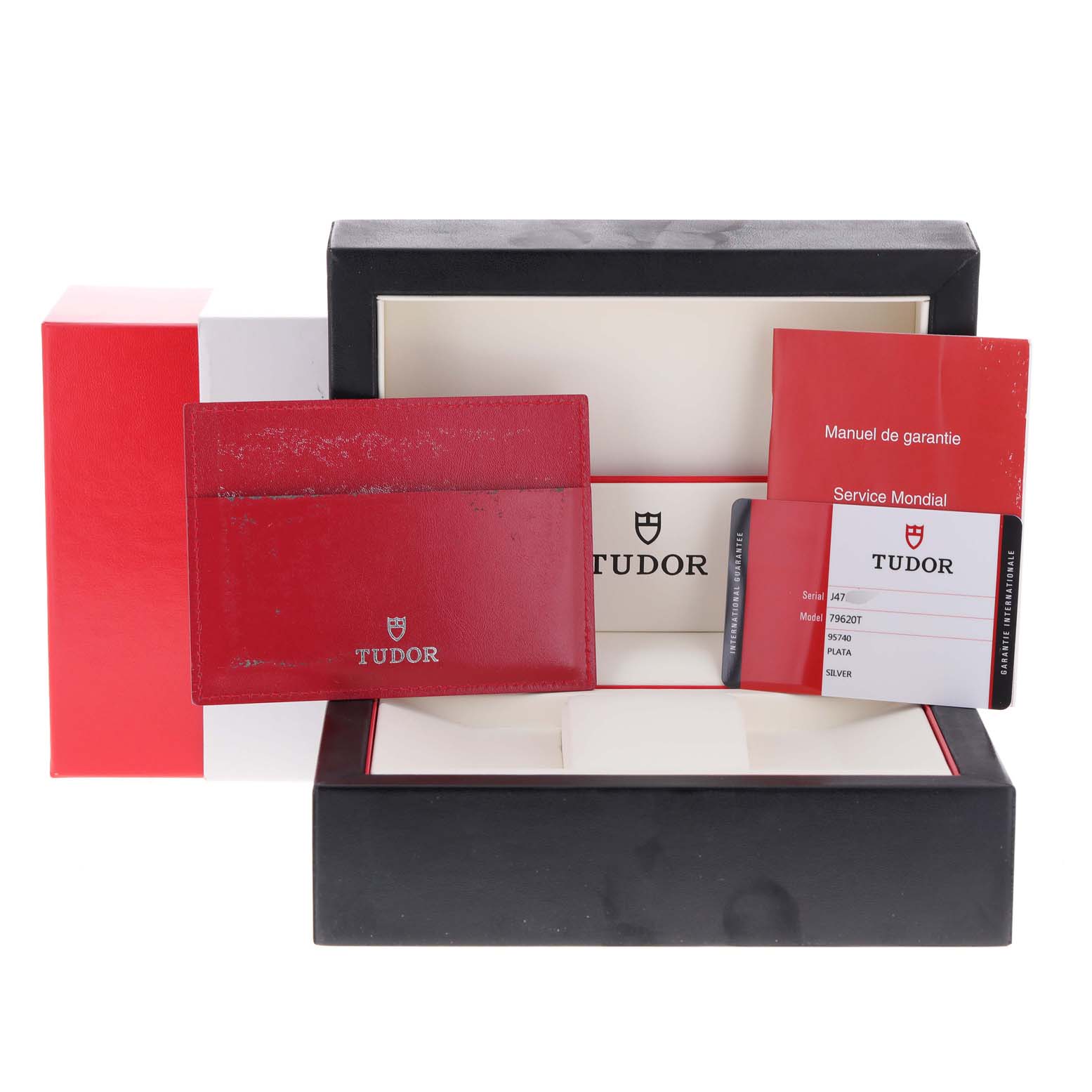 The image shows the packaging and documents of a Tudor Heritage Advisor M79620T-0001 Men's Stainless Steel Silver Dial M79620T-0001 Men's Stainless Steel Silver Dial watch, including the box, warranty card, and manual.