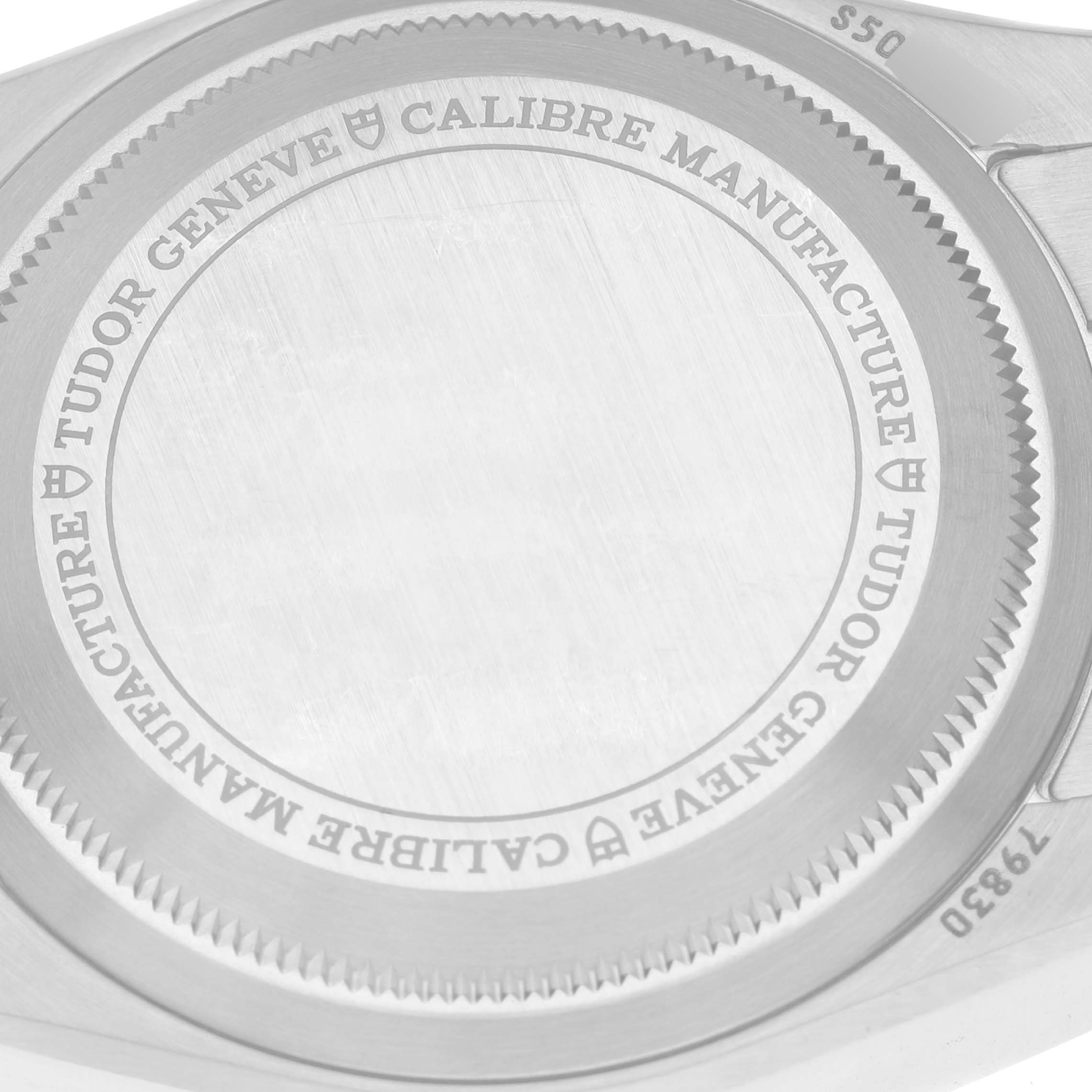 This image shows the back case of the Tudor Heritage Black Bay 79830RB Men's Stainless Steel Silver Dial 79830RB Men's Stainless Steel Silver Dial watch with engraved details.