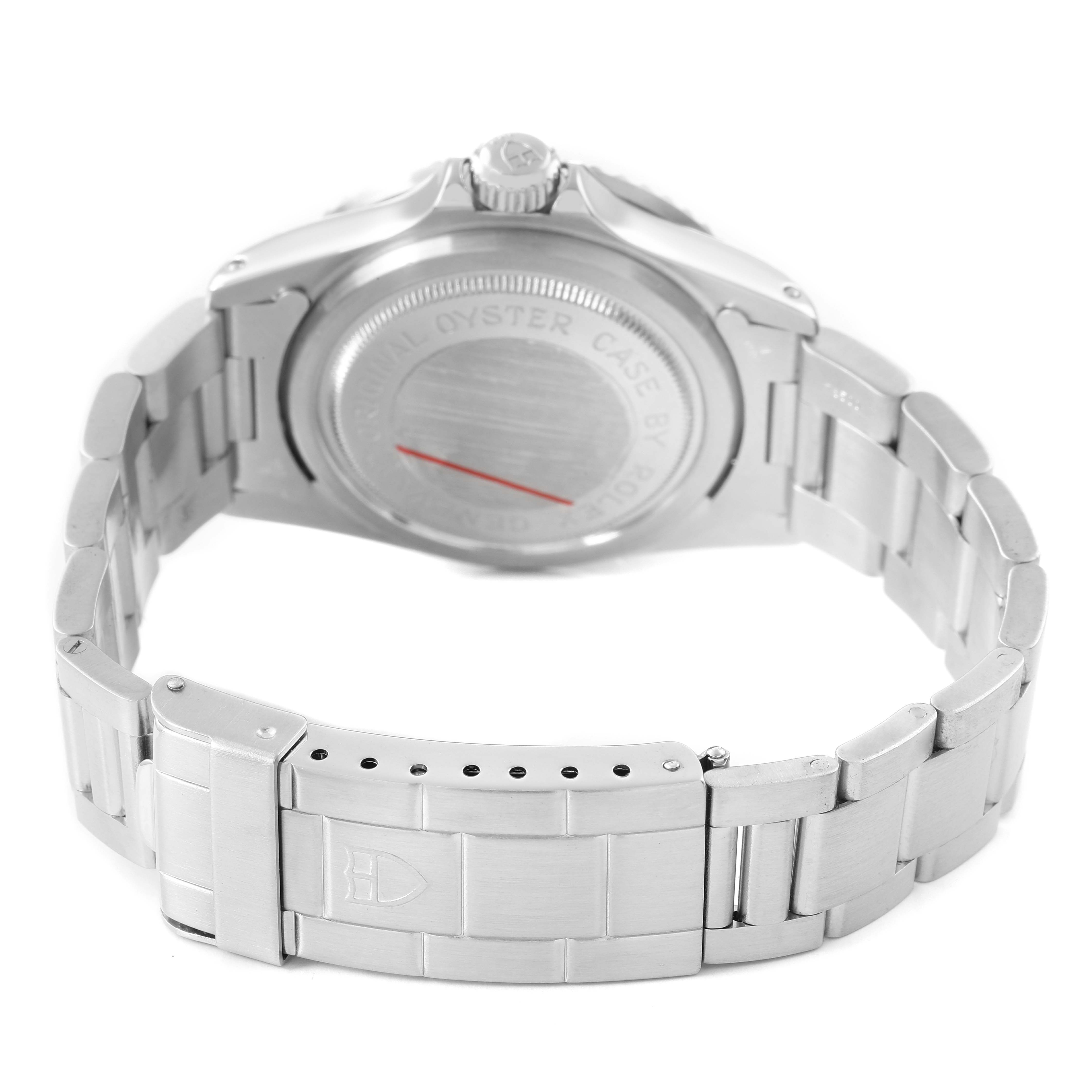 The Tudor Submariner 9411 Men's Stainless Steel Blue Dial watch is shown from the back, highlighting the case back, crown, and bracelet.