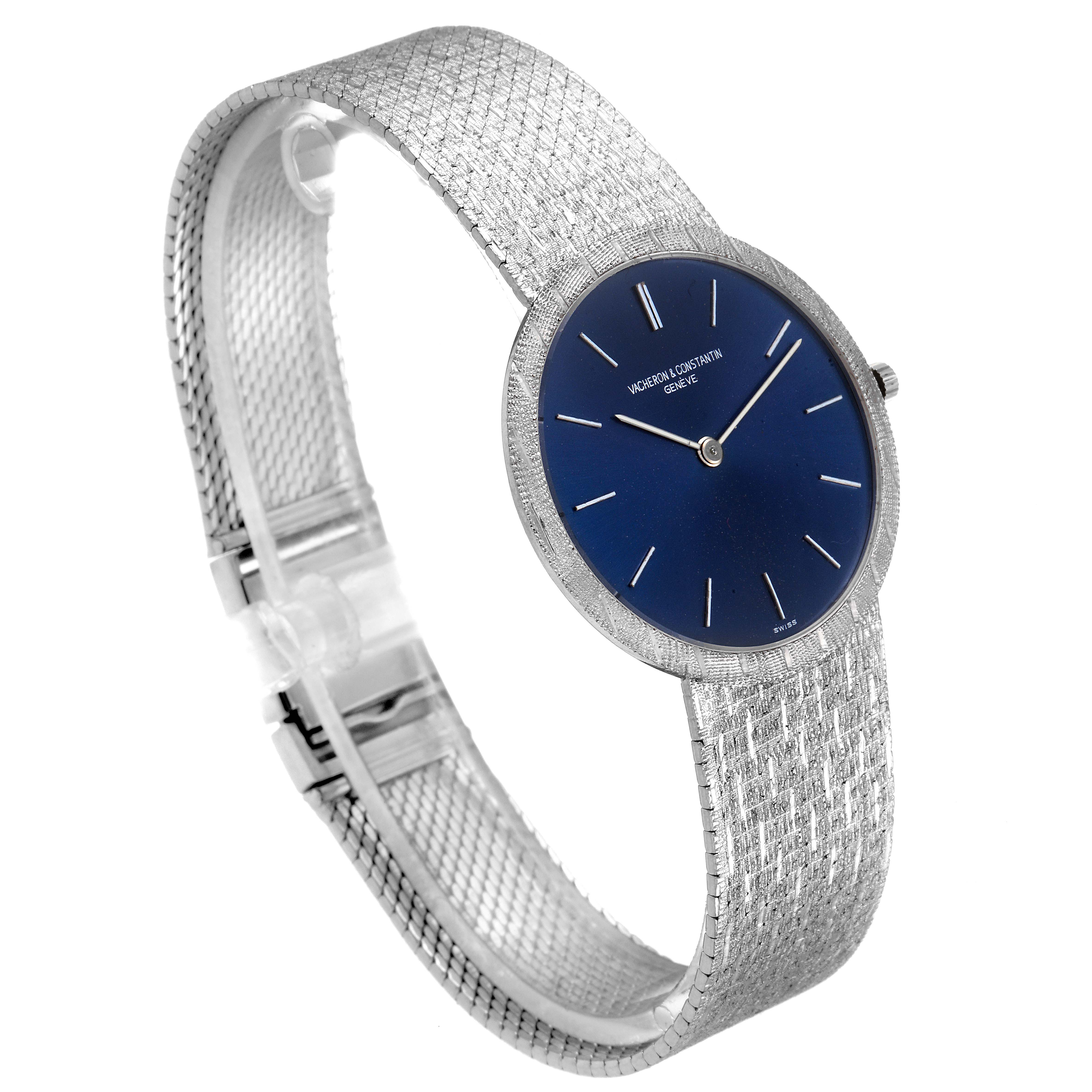 The Vacheron Constantin Patrimony 6352 Men's White Gold Blue Dial 6352 Men's White Gold Blue Dial watch is shown from a three-quarter angle, highlighting its blue dial, silver case, and textured bracelet.