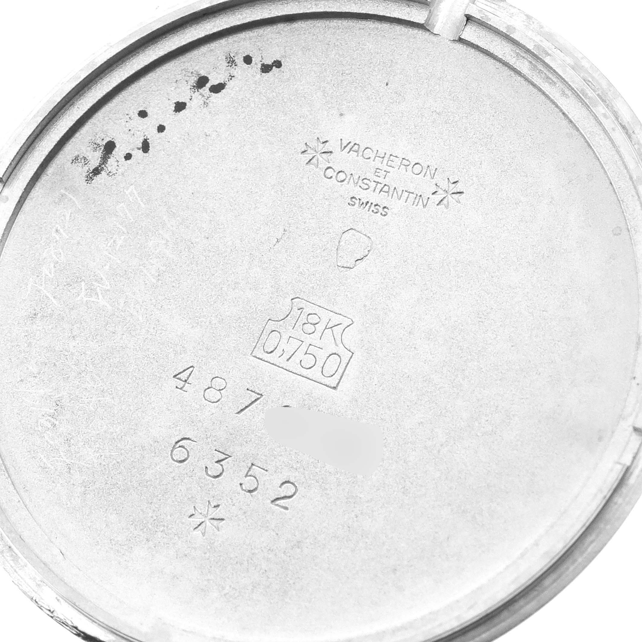 This image shows the inside case back of a Vacheron Constantin Patrimony 6352 Men's White Gold Blue Dial 6352 Men's White Gold Blue Dial watch with engravings and hallmarks.