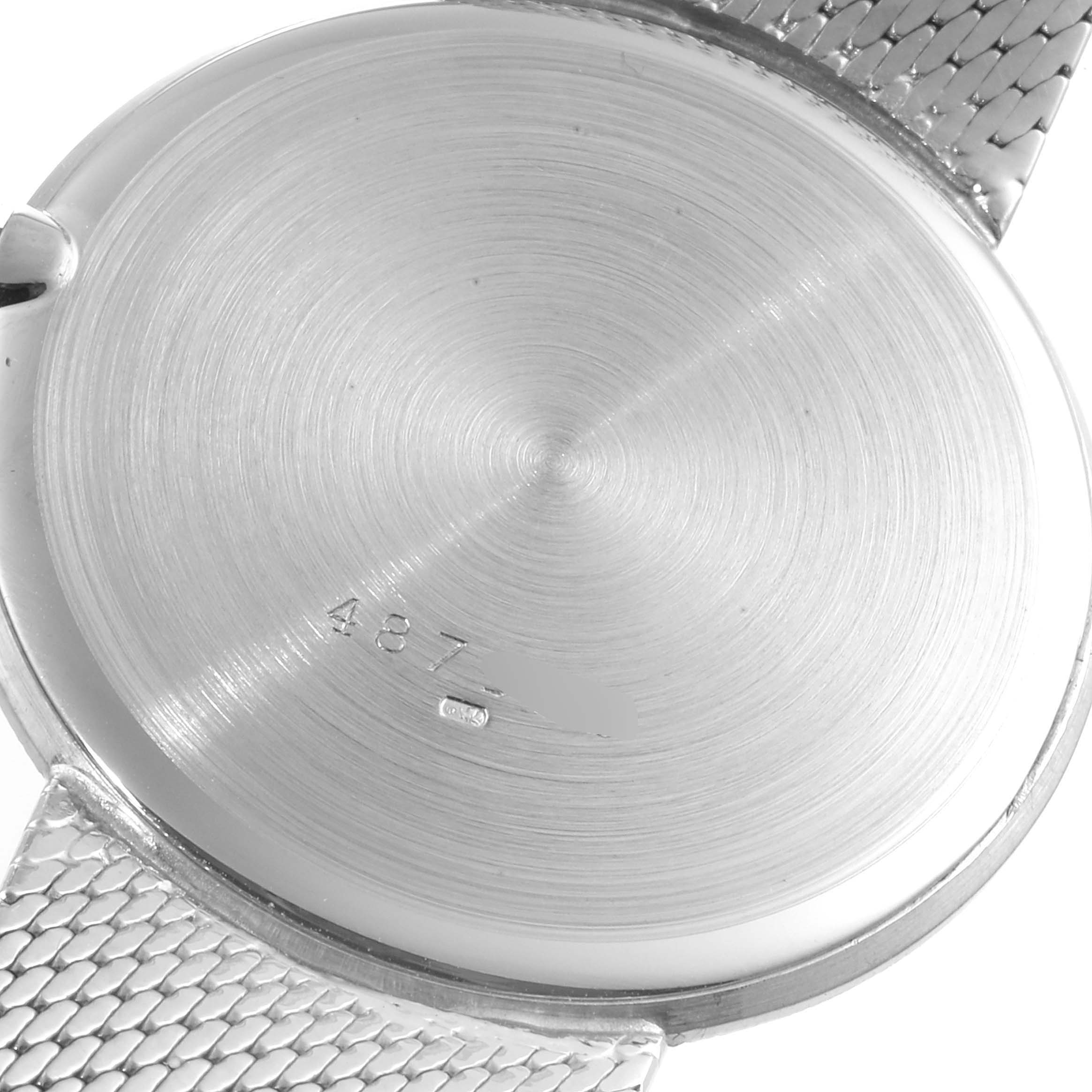 This image shows the case back and part of the metal bracelet of a Vacheron Constantin Patrimony 6352 Men's White Gold Blue Dial 6352 Men's White Gold Blue Dial watch.