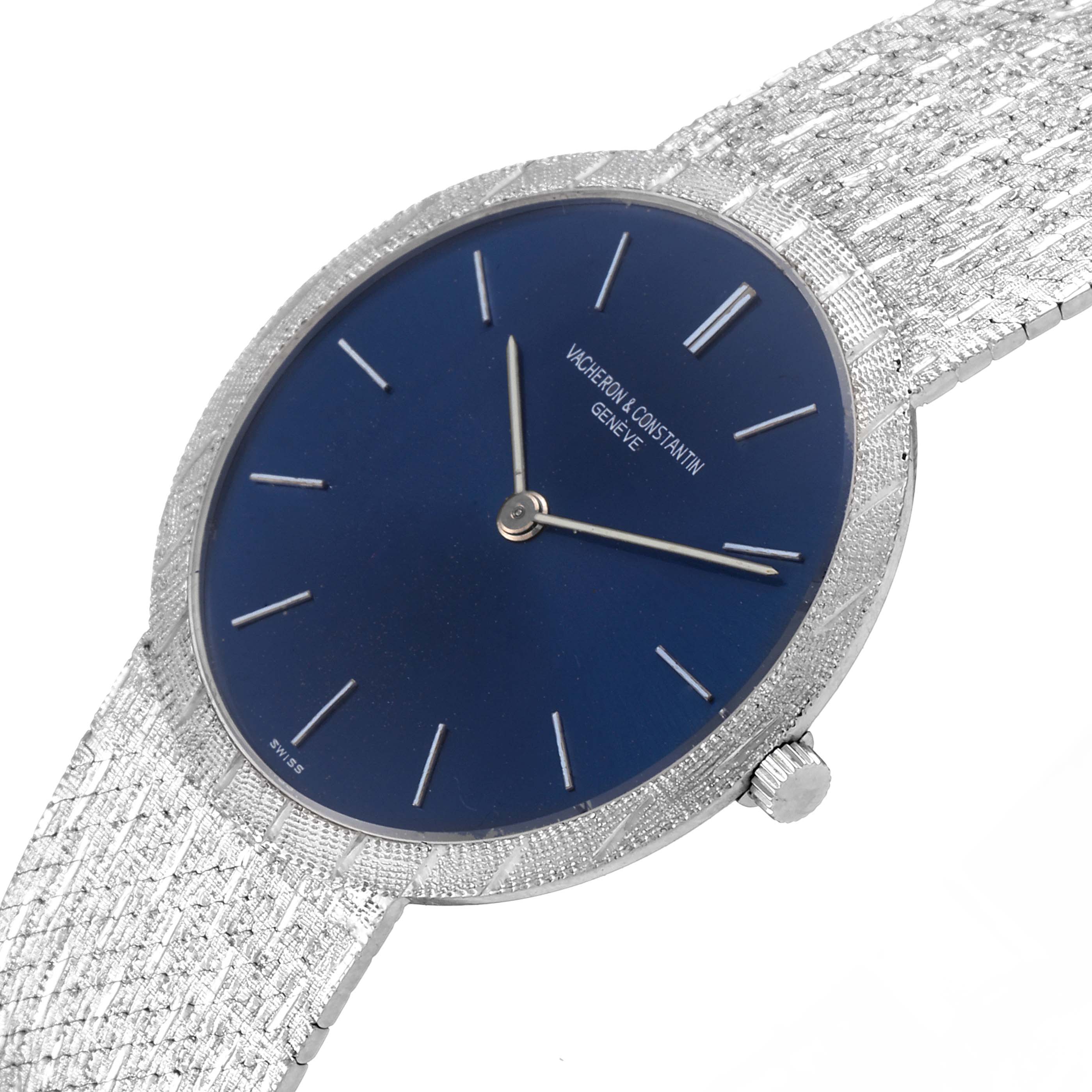 The image shows a Vacheron Constantin Patrimony 6352 Men's White Gold Blue Dial 6352 Men's White Gold Blue Dial watch from a tilted angle, highlighting its dial, crown, and textured bracelet.