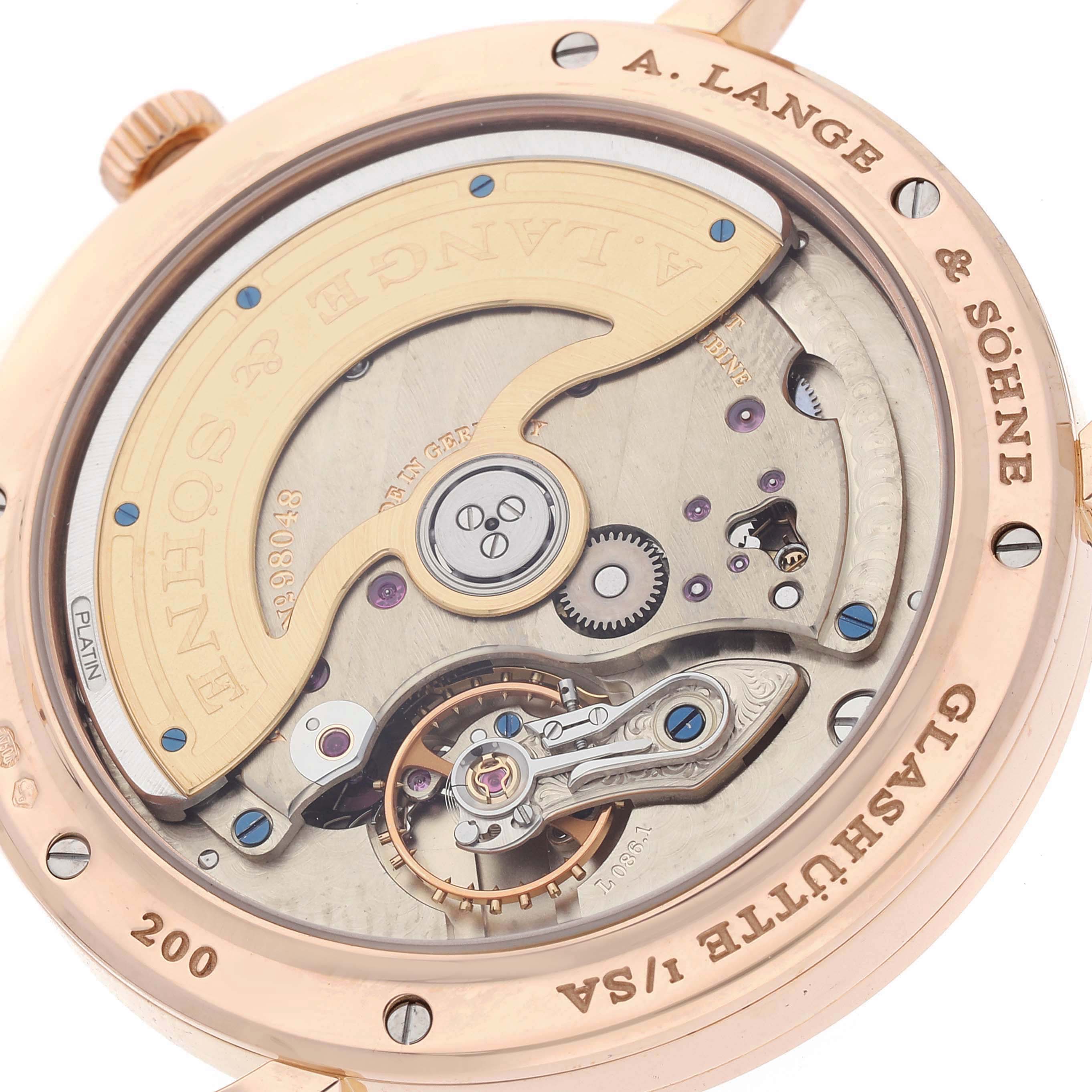 The image shows the back of an A. Lange & Sohne Saxonia 842.032 Men's Rose Gold Silver Dial watch, highlighting its intricate movement and rotor.
