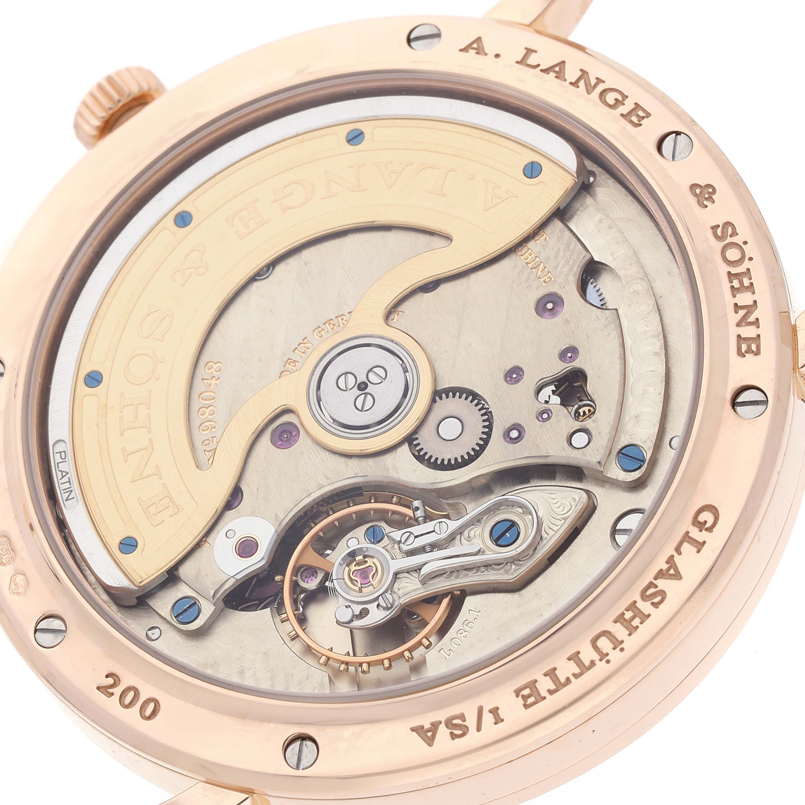 The image shows the back view of the A. Lange & Sohne Saxonia watch, highlighting its intricate movement and rotor.