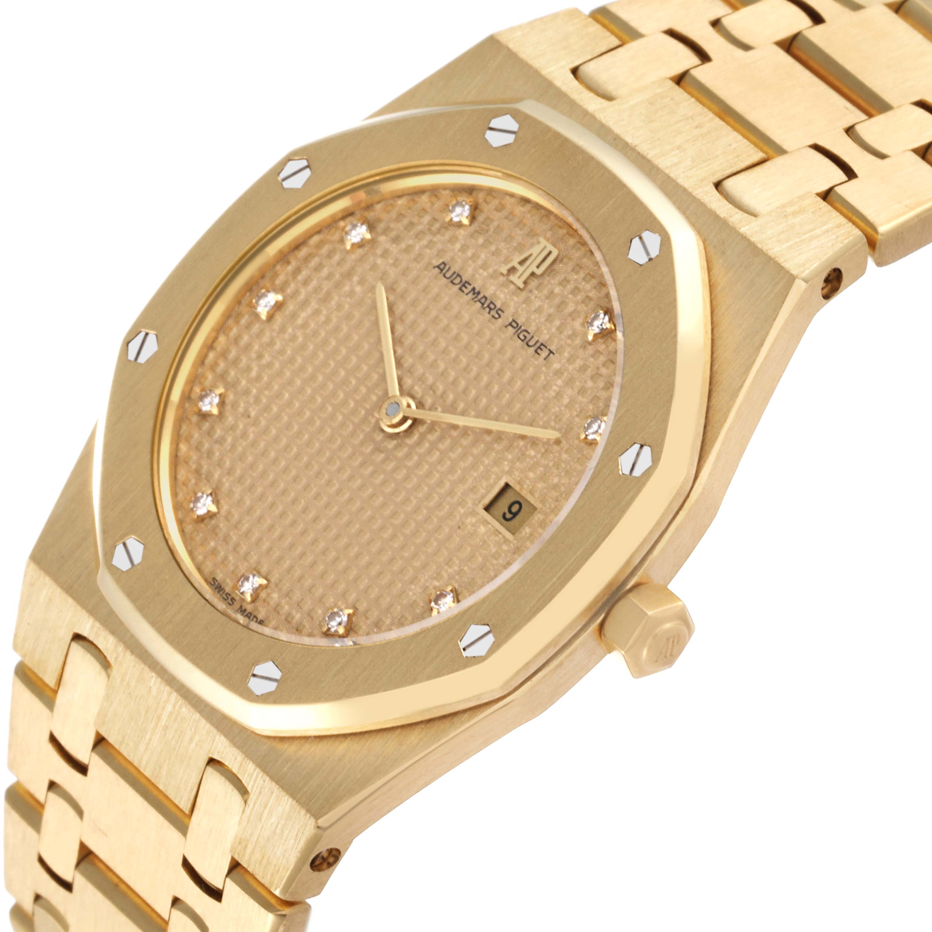 This Audemars Piguet Royal Oak 56303 Men's Yellow Gold Champagne Dial 56303 Men's Yellow Gold Champagne Dial watch is shown at a slight angle showcasing its dial, bezel, date window, and part of the bracelet.