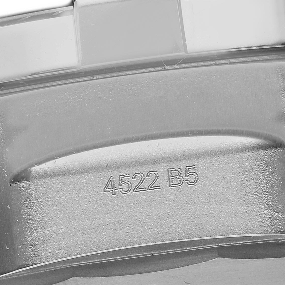 The image shows the engraved case back of a Breitling Avenger A17319 Men's Stainless Steel Yellow Dial A17319 Men's Stainless Steel Yellow Dial model, viewed close-up.