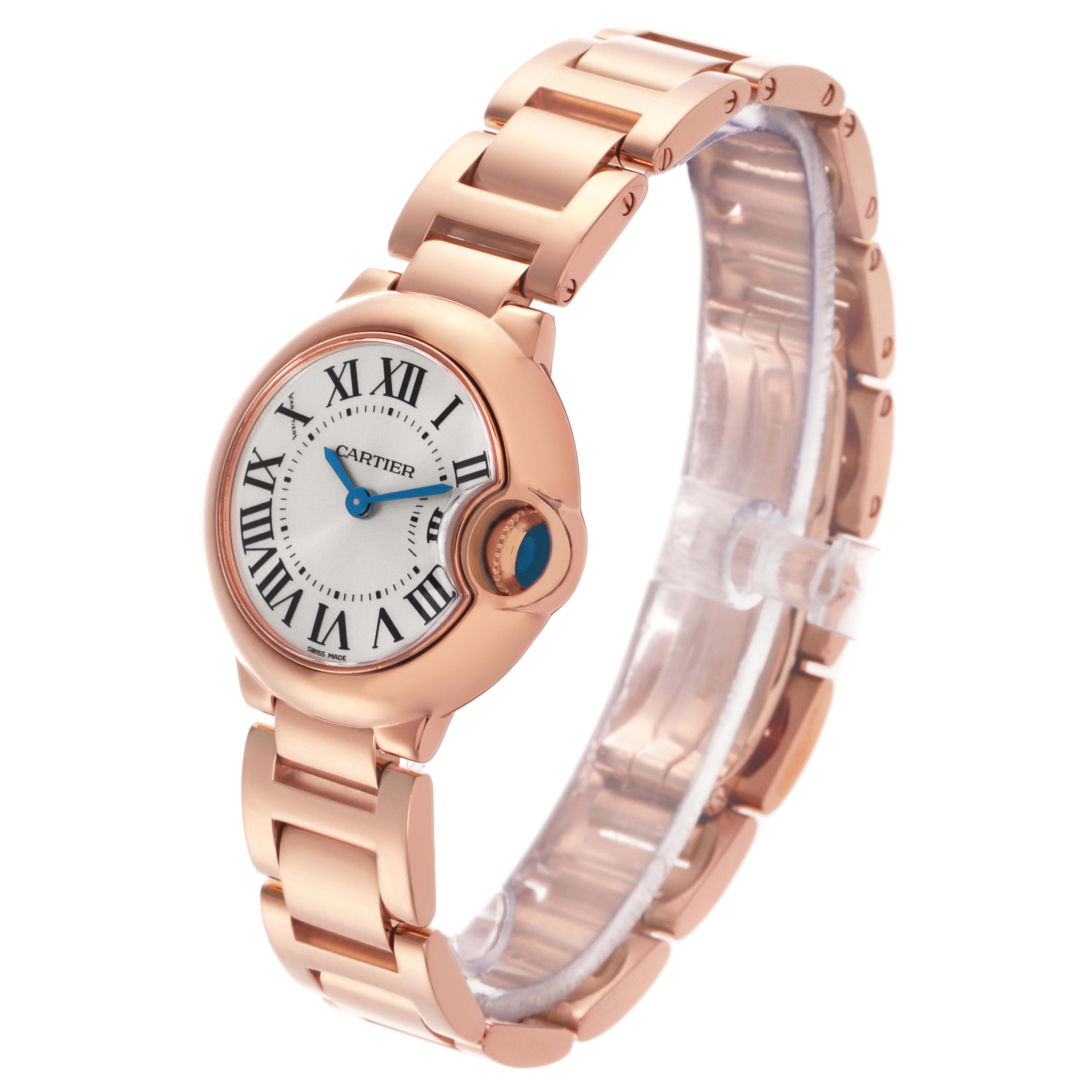 The Cartier Ballon Bleu W69002Z2 Women
s Rose Gold White Dial W69002Z2 Women
s Rose Gold White Dial watch is shown at a three-quarter angle, displaying the face, crown, and part of the bracelet.