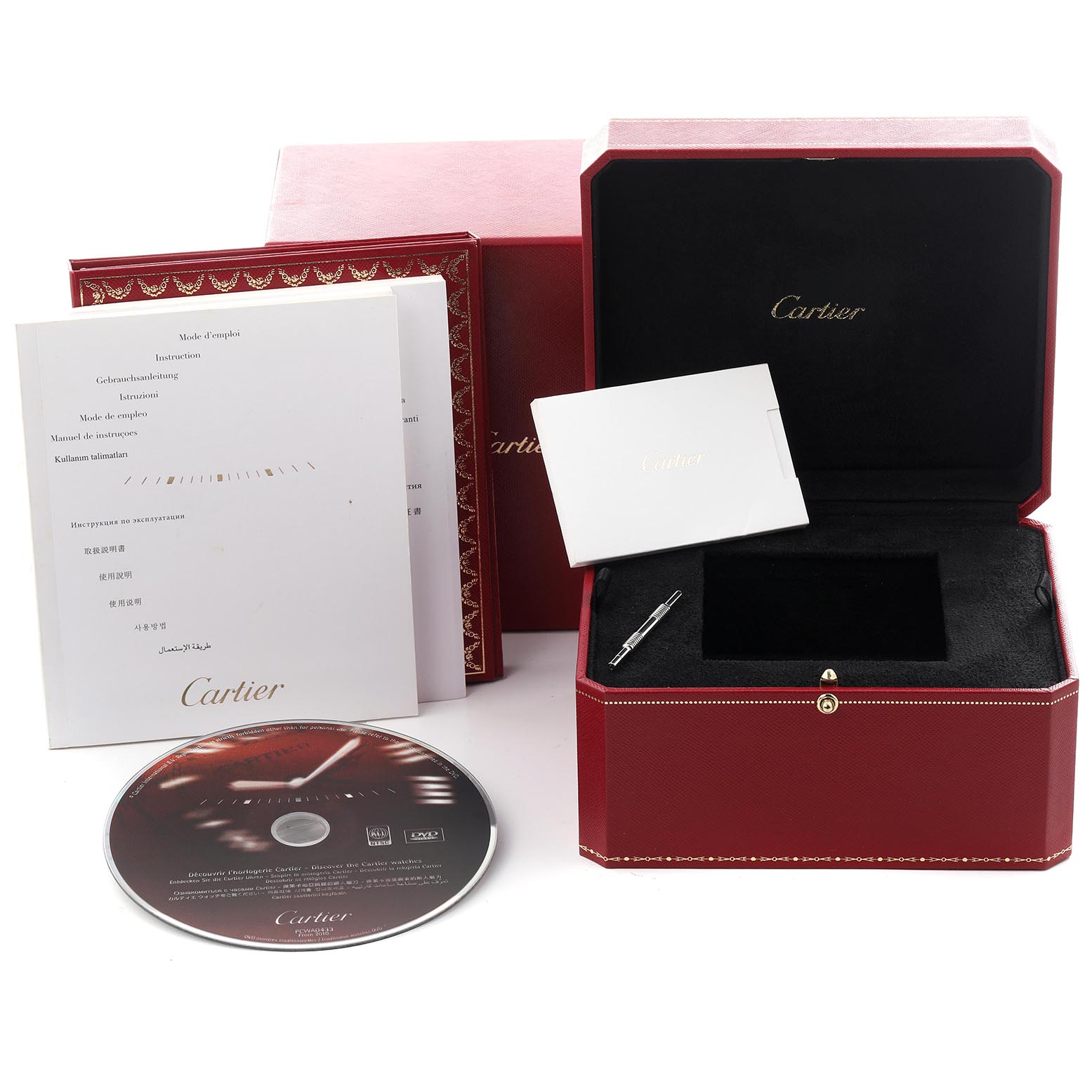 The image shows packaging and accessories for a Cartier Ballon Bleu W69002Z2 Women
s Rose Gold White Dial W69002Z2 Women
s Rose Gold White Dial, including a box, booklets, a disc, and a tool.