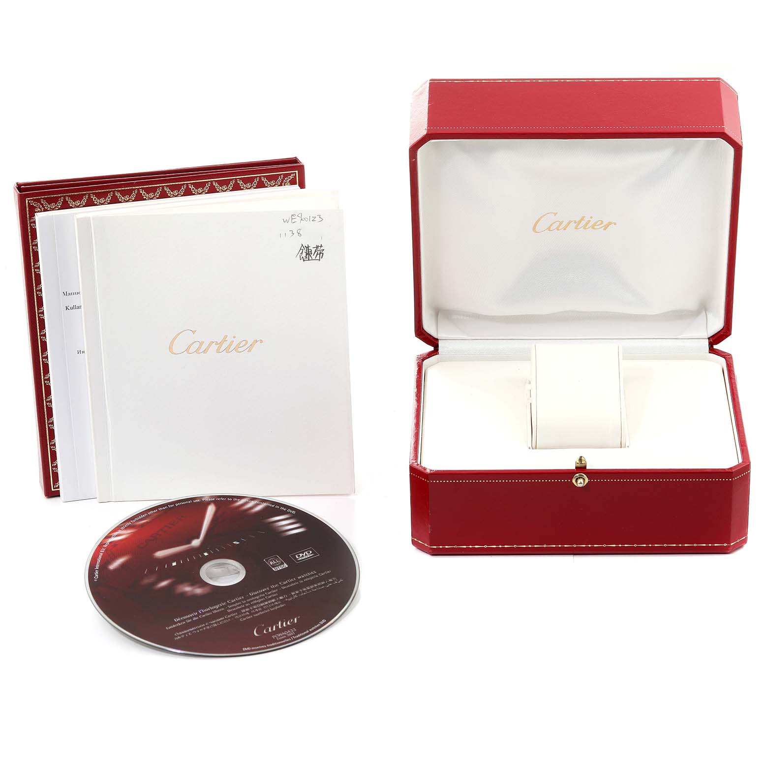 This image shows the packaging, documents, and a CD of a Cartier Ballon Bleu WE9001Z3 Women's Yellow Gold Silver Dial WE9001Z3 Women's Yellow Gold Silver Dial watch, with an open red watch box.