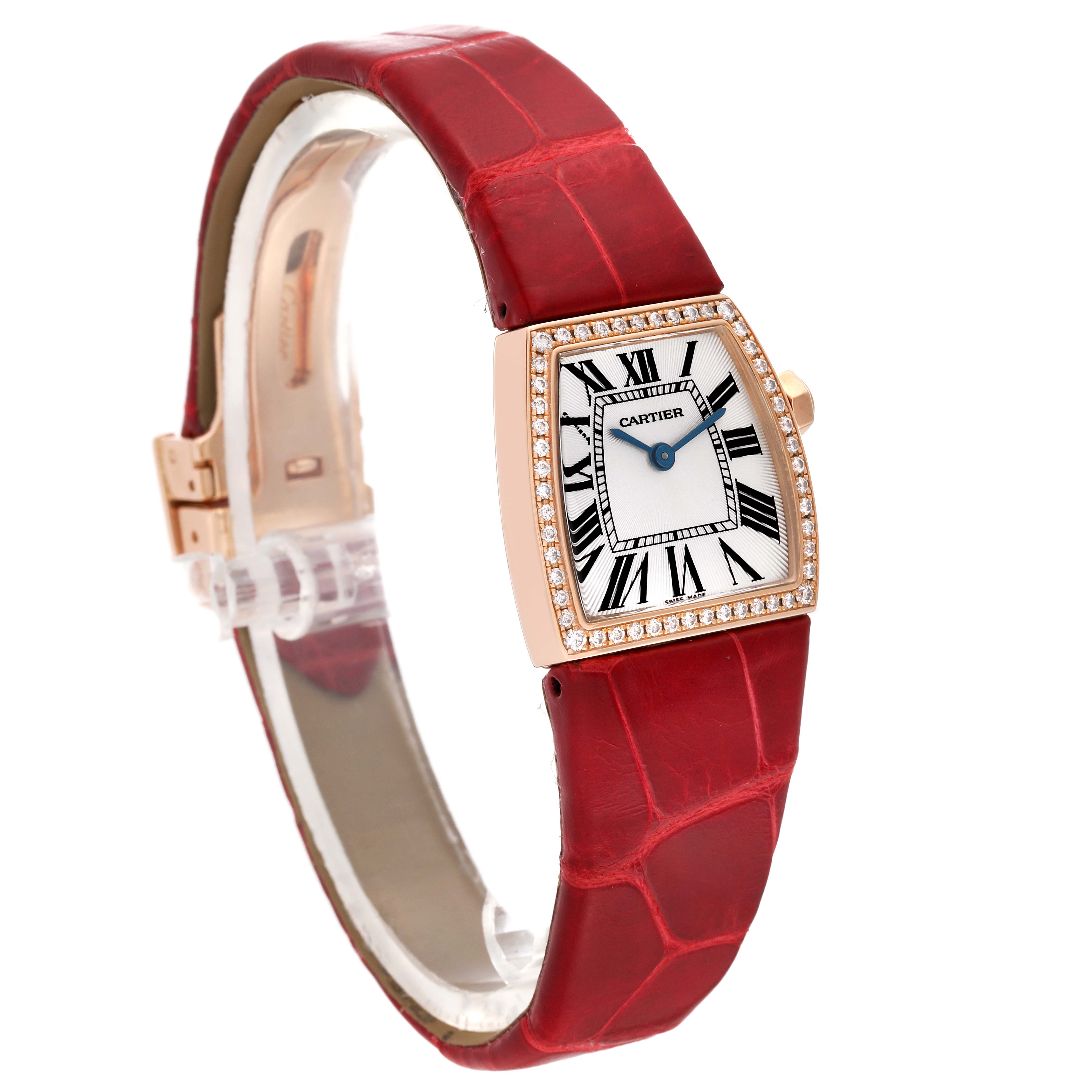 The image shows a La Dona model by Cartier from a three-quarter view, highlighting the red leather strap, face, and bezel.